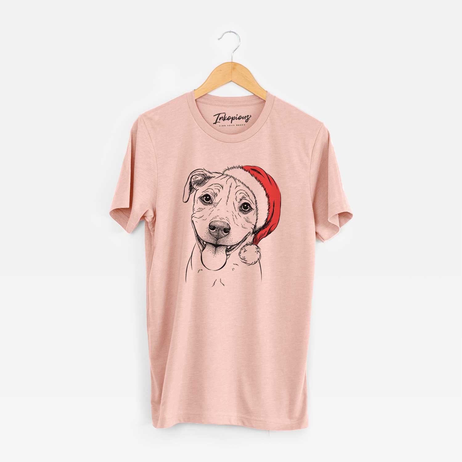 Hand-drawn sketch of Skye the Pitweiler wearing a Santa hat on a Peach Unisex crewneck