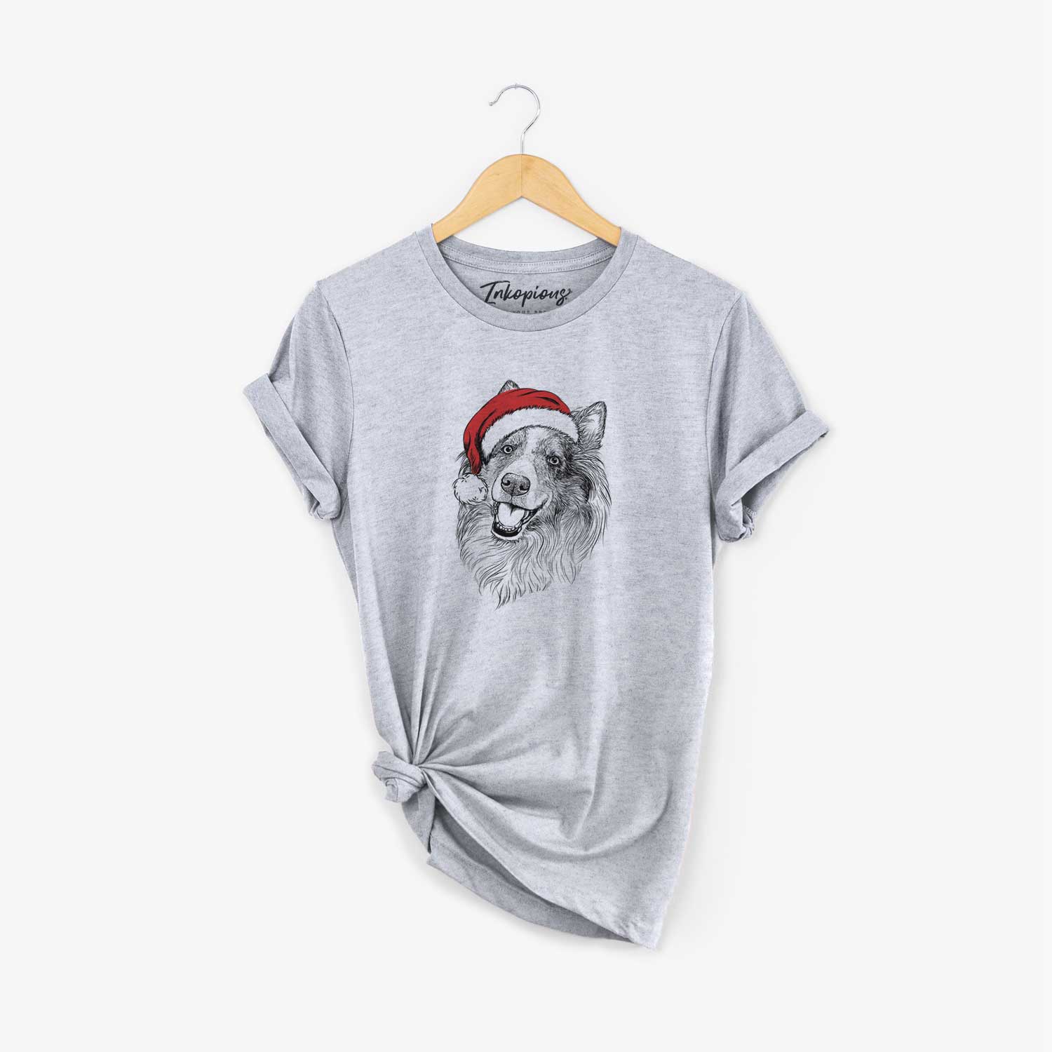 Hand-drawn sketch of Skylar the Shetland Sheepdog wearing a Santa hat on a Grey Unisex crewneck