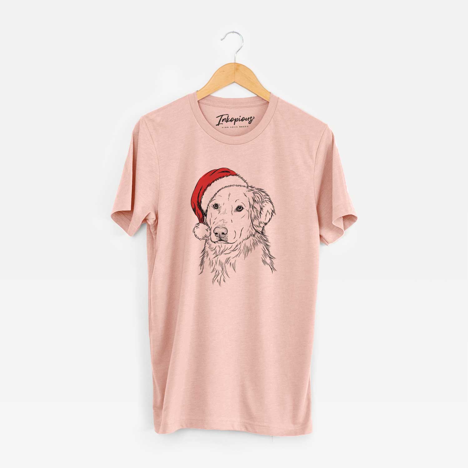 Hand-drawn sketch of Spencer the Golden Retriever wearing a Santa hat on a Peach Unisex crewneck