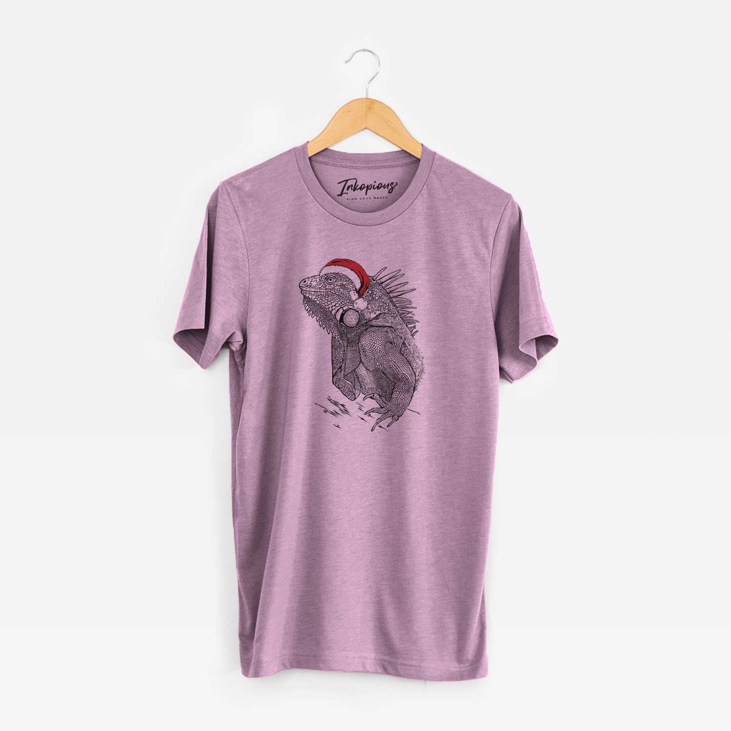 Hand-drawn sketch of Spike the Iguana wearing a Santa hat on an Orchid Unisex crewneck