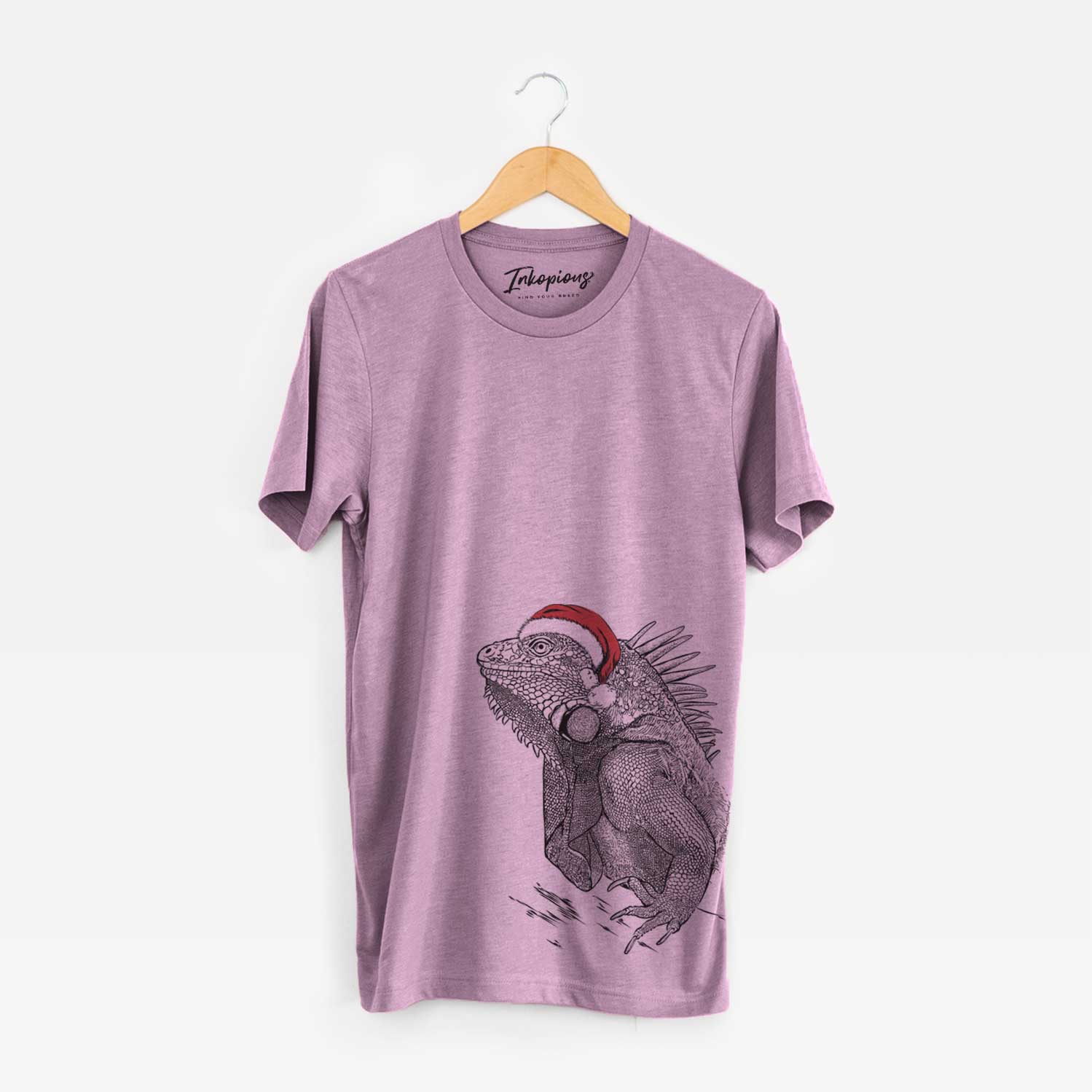 Hand-drawn sketch of Spike the Iguana wearing a Santa hat on an Orchid Unisex crewneck