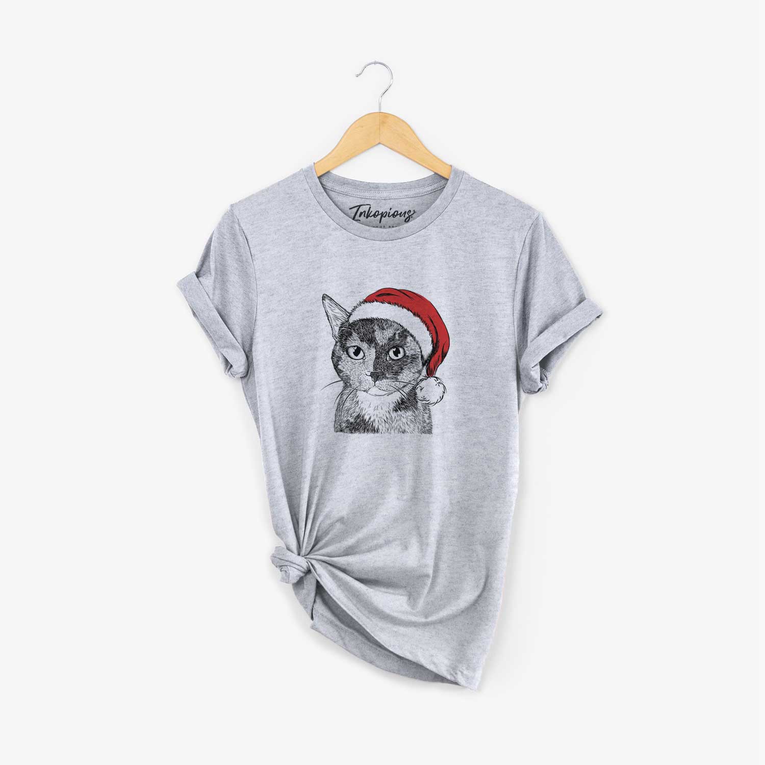 Hand-drawn sketch of Spooky Kitty the Tortoiseshell Cat wearing a Santa hat on a Grey Unisex crewneck