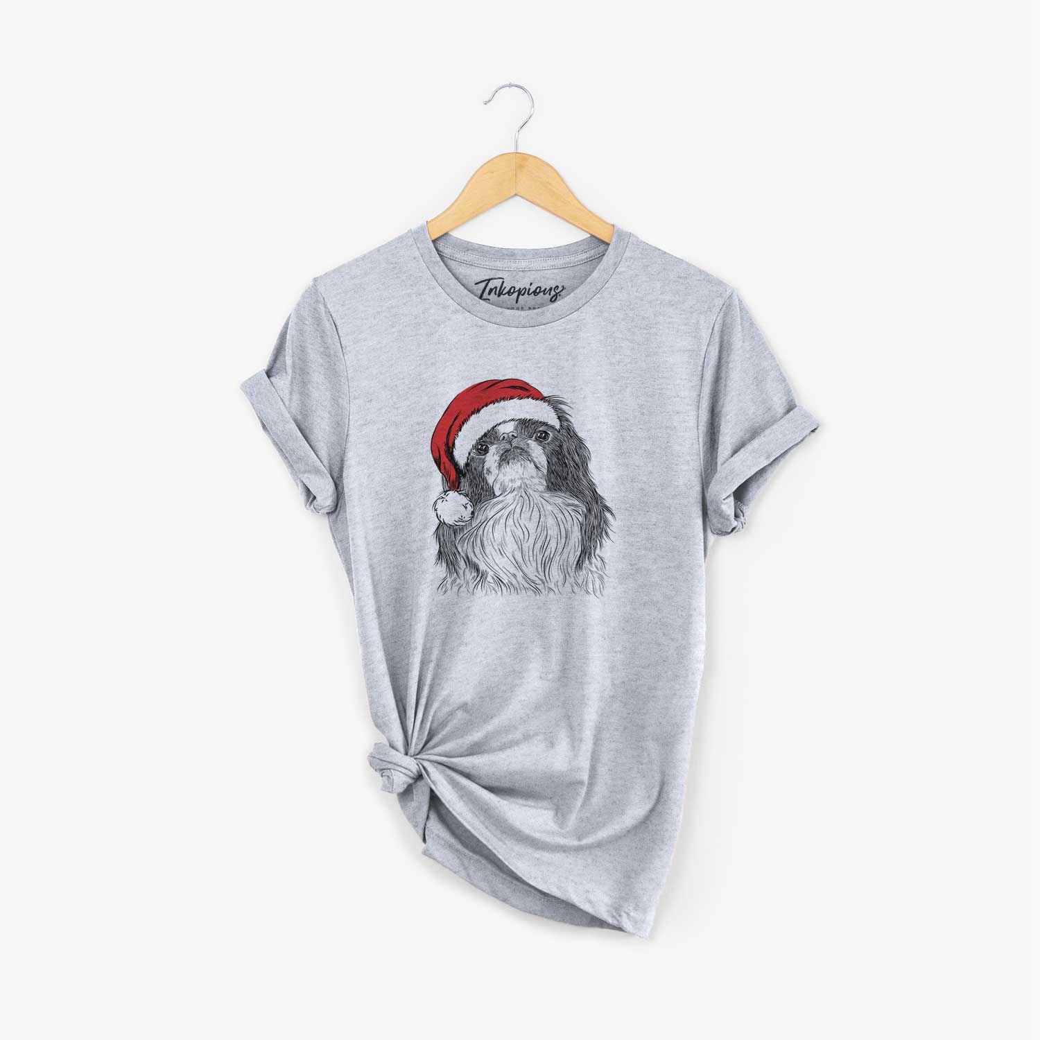 Hand-drawn sketch of Suki the Japanese Chin wearing a Santa hat on a Grey Unisex crewneck