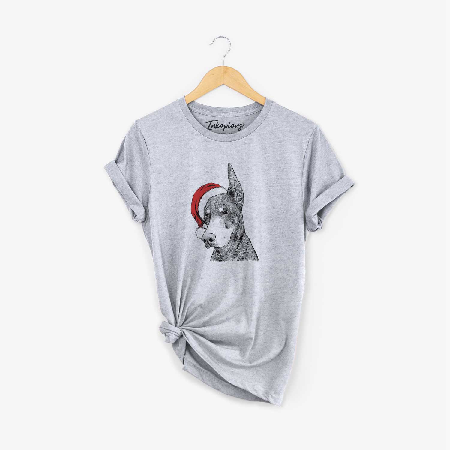 Hand-drawn sketch of Sunny the Doberman Pinscher wearing a Santa hat on a Grey Unisex crewneck