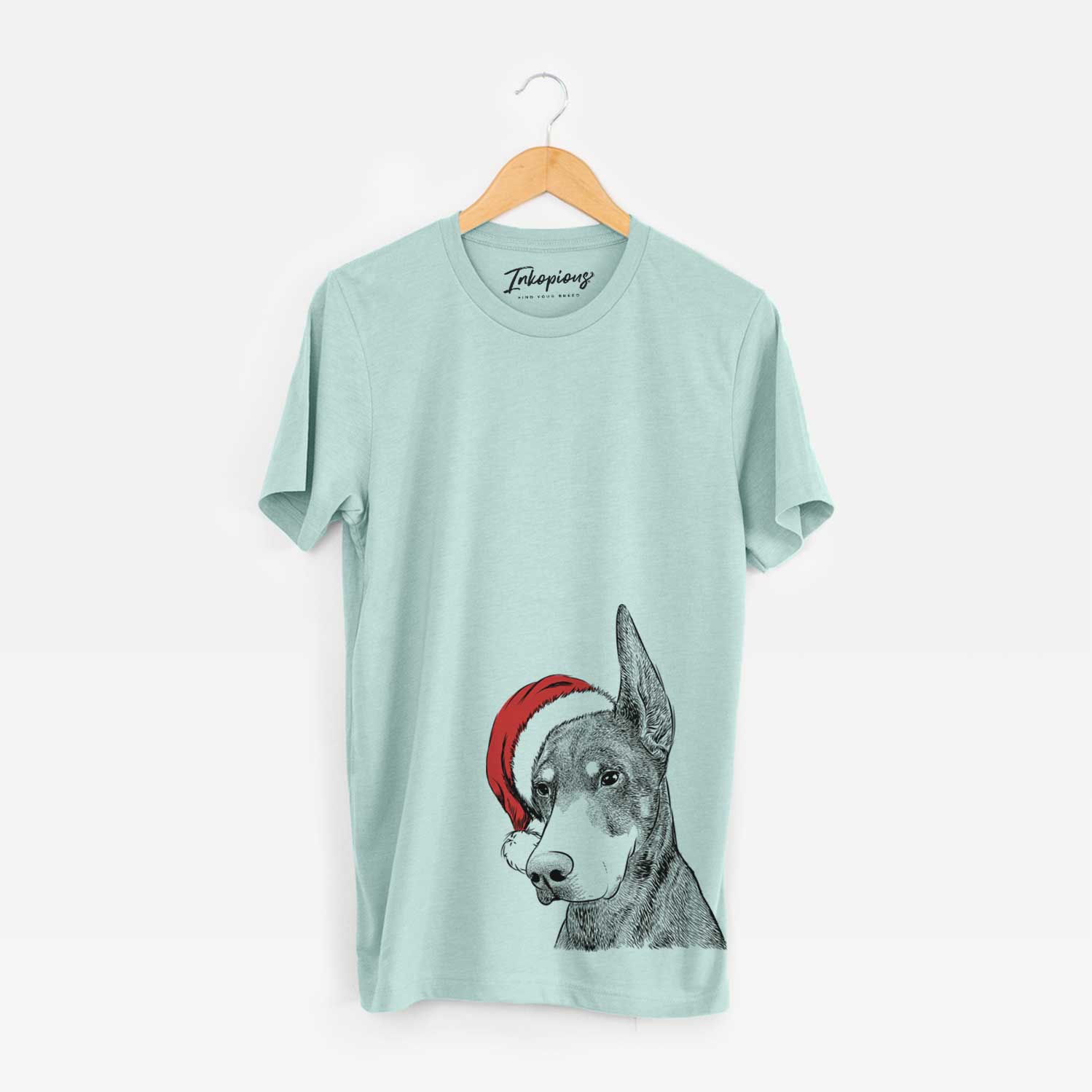 Hand-drawn sketch of Sunny the Doberman Pinscher wearing a Santa hat on a Heather Sage Unisex crewneck