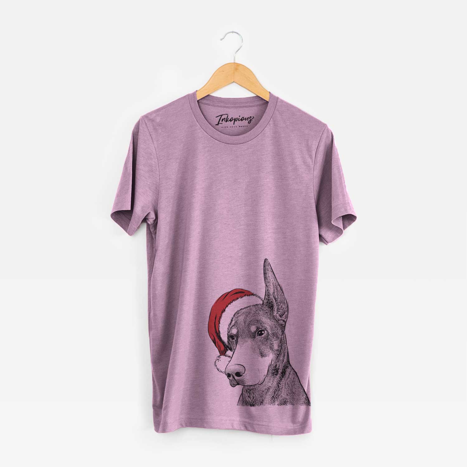 Hand-drawn sketch of Sunny the Doberman Pinscher wearing a Santa hat on an Orchid Unisex crewneck