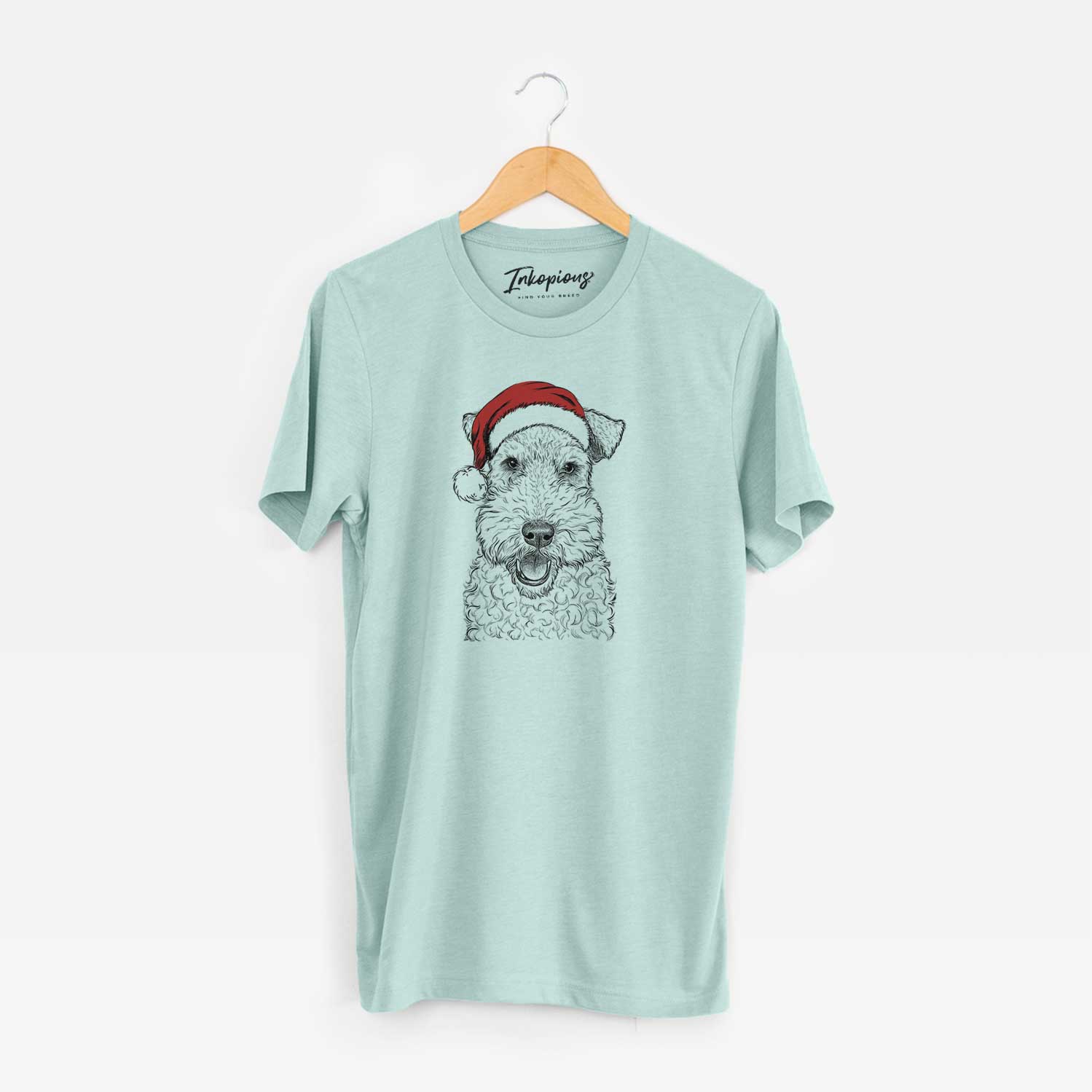 Hand-drawn sketch of Ted the Wire Fox Terrier wearing a Santa hat on a Heather Sage Unisex crewneck