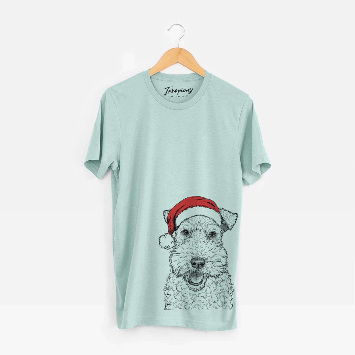 Hand-drawn sketch of Ted the Wire Fox Terrier wearing a Santa hat on a Heather Sage Unisex crewneck