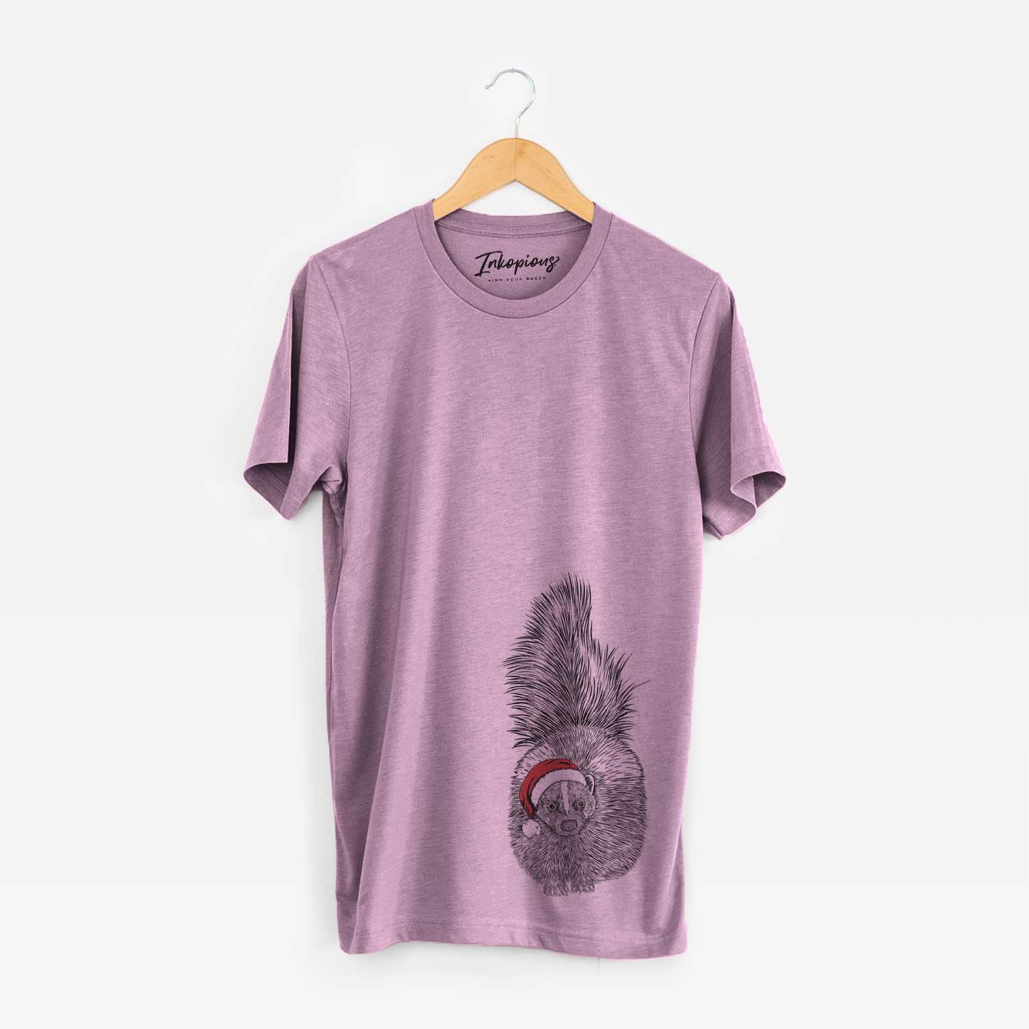 Hand-drawn sketch of Tibbs the Skunk wearing a Santa hat on an Orchid Unisex crewneck