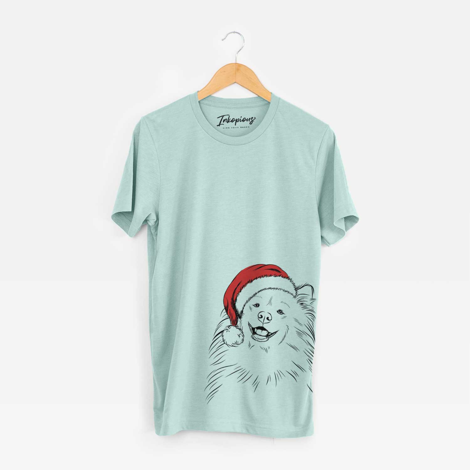 Hand-drawn sketch of Tillie the Samoyed wearing a Santa hat on a Heather Sage Unisex crewneck