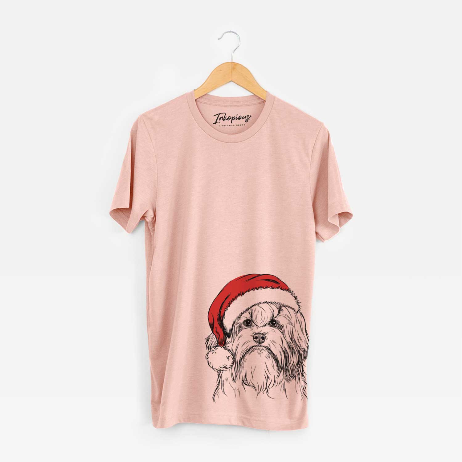Hand-drawn sketch of Tootsie the Lowchen wearing a Santa hat on a Peach Unisex crewneck