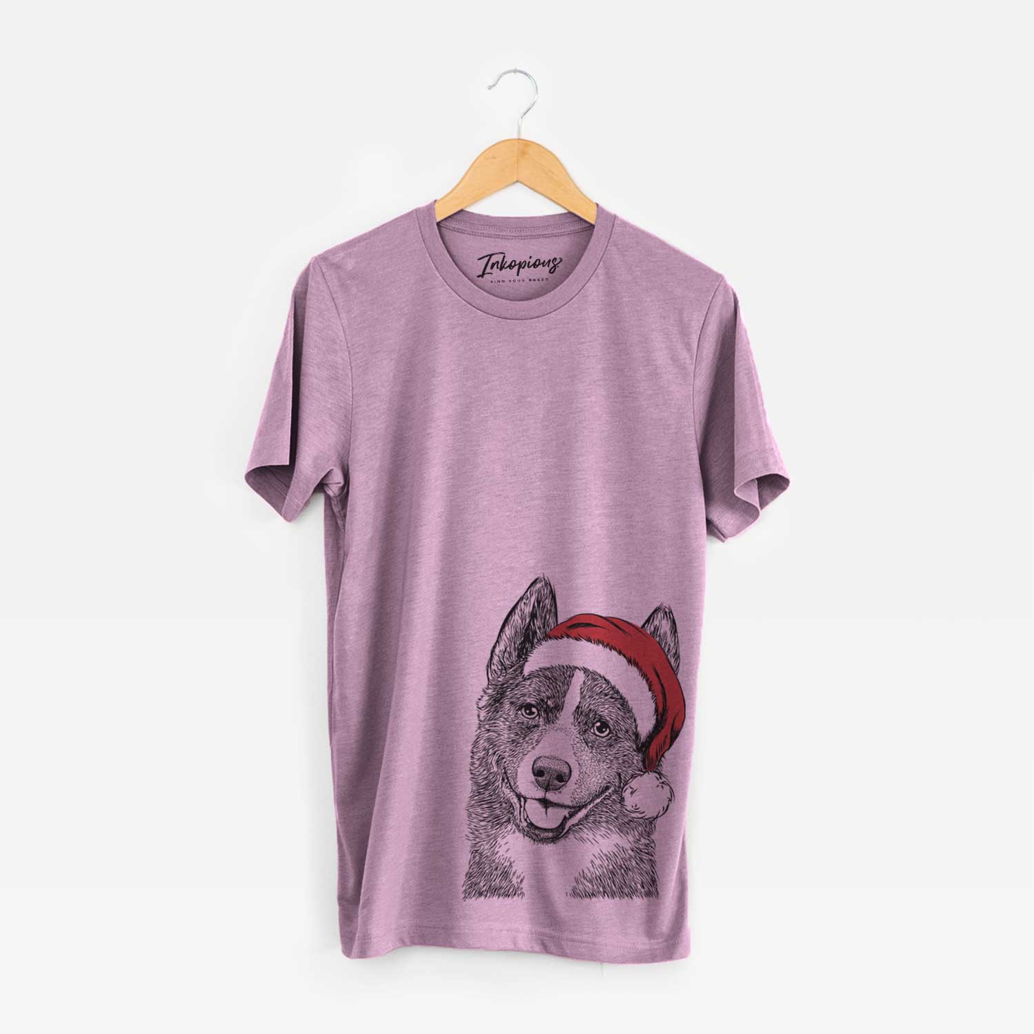 Hand-drawn sketch of Tosca the Karelian Bear Dog wearing a Santa hat on an Orchid Unisex crewneck