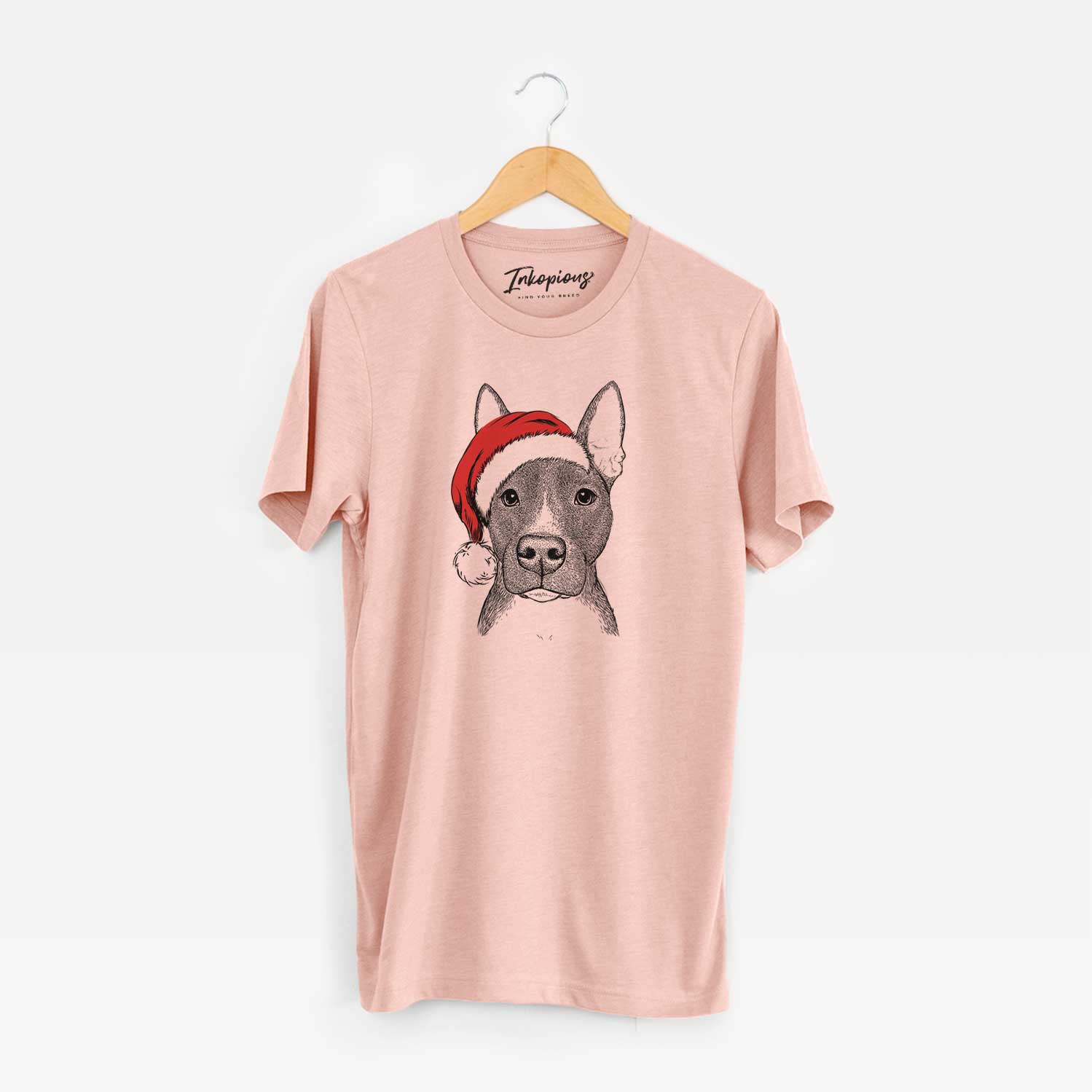 Hand-drawn sketch of Violet the Pitbull wearing a Santa hat on a Peach Unisex crewneck