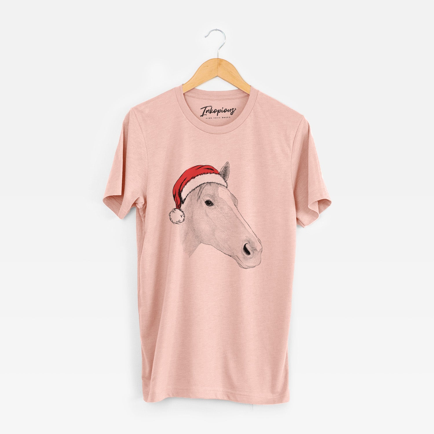 Hand-drawn sketch of Westley the Horse wearing a Santa hat on a Peach Unisex crewneck