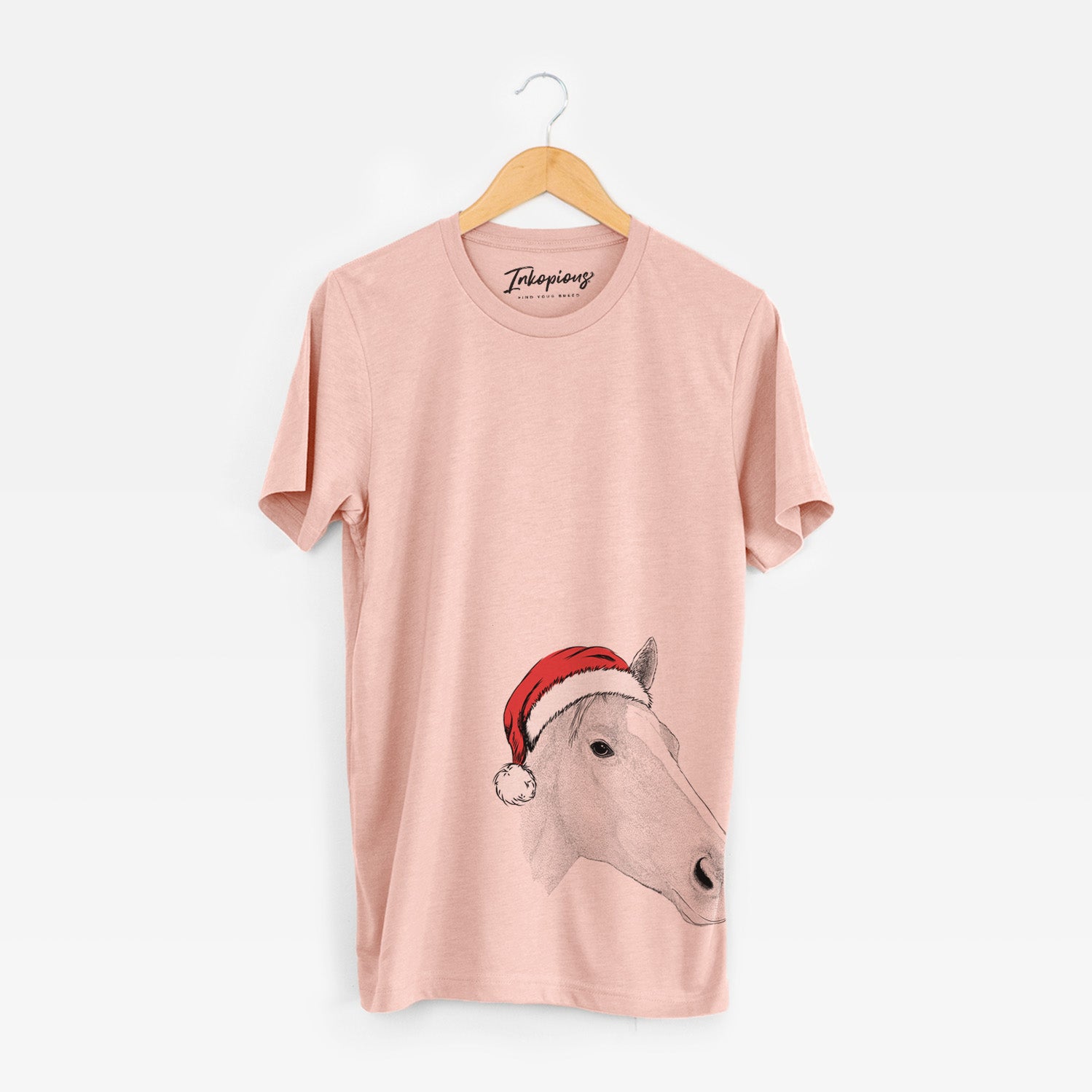 Hand-drawn sketch of Westley the Horse wearing a Santa hat on a Peach Unisex crewneck