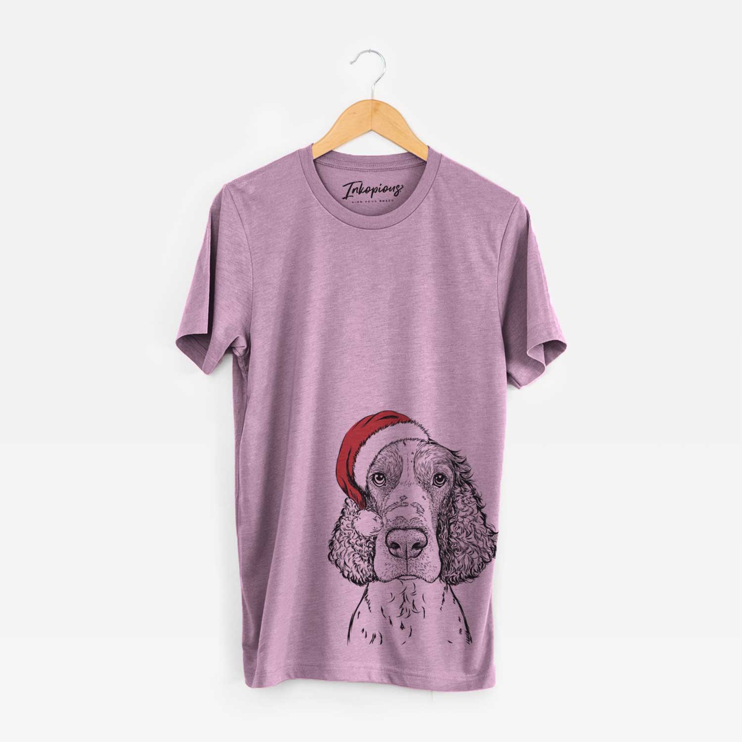 Hand-drawn sketch of Wilbur the English Springer Spaniel wearing a Santa hat on an Orchid Unisex crewneck