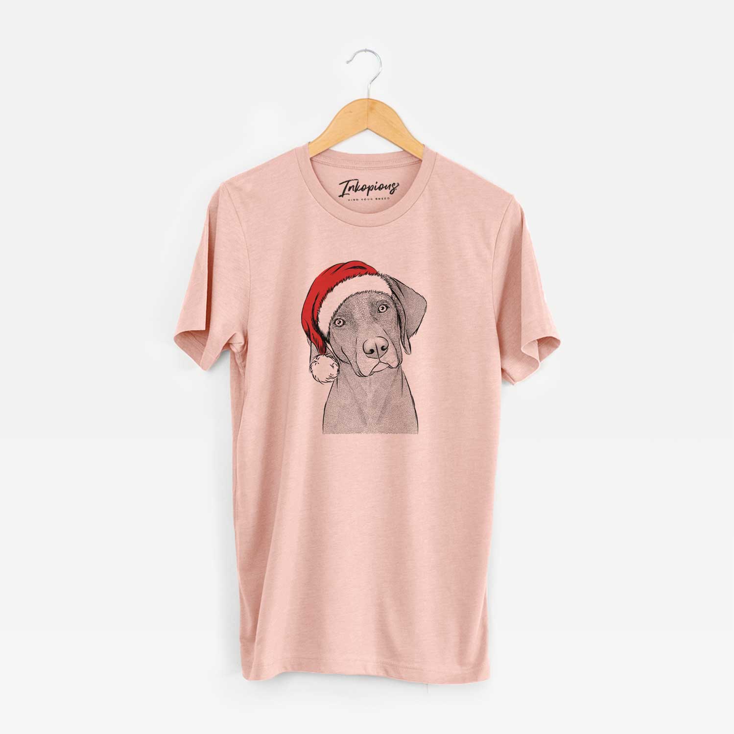 Hand-drawn sketch of Willow the Weizsla wearing a Santa hat on a Peach Unisex crewneck
