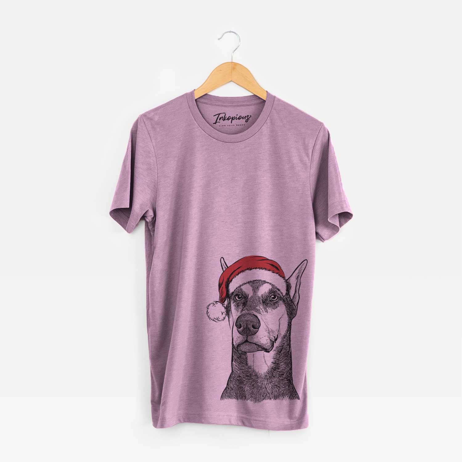 Hand-drawn sketch of Zeus the Doberman Pinscher wearing a Santa hat on an Orchid Unisex crewneck