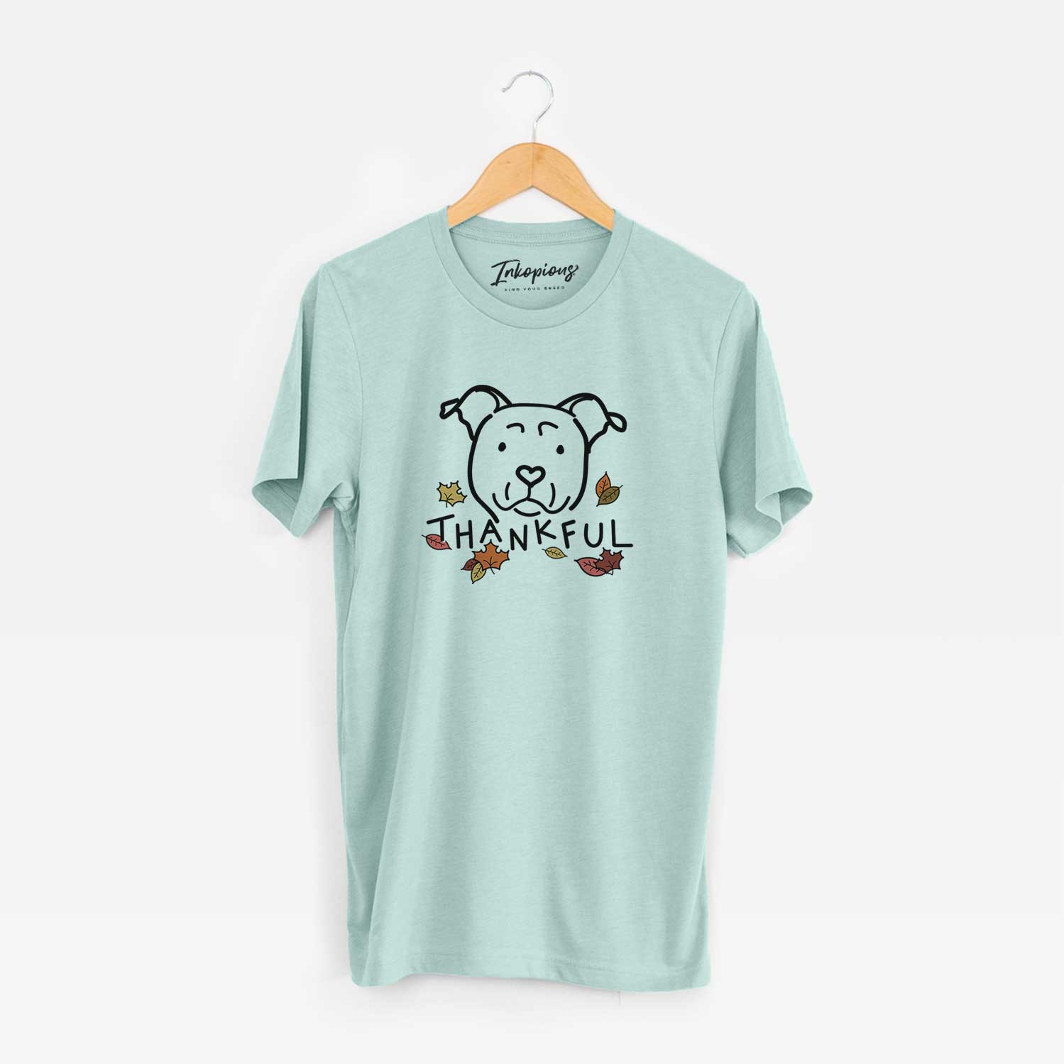 Minimalist line drawing of an American Staffordshire Terrier with 'Thankful' lettering on a Heather Sage Unisex crewneck