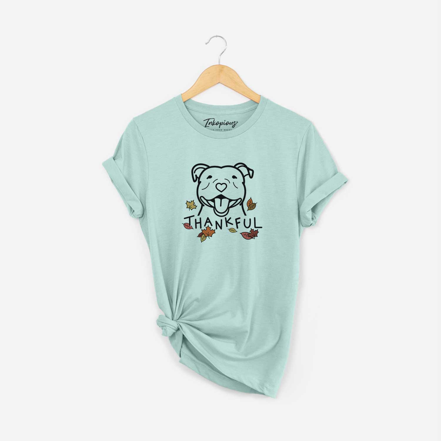 Minimalist line drawing of a Happy American Staffordshire Terrier with 'Thankful' lettering on a Heather Sage Unisex crewneck