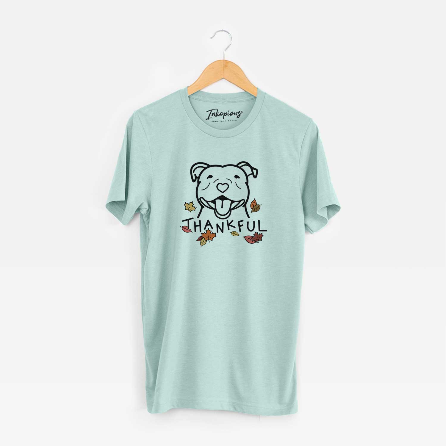 Minimalist line drawing of a Happy American Staffordshire Terrier with 'Thankful' lettering on a Heather Sage Unisex crewneck