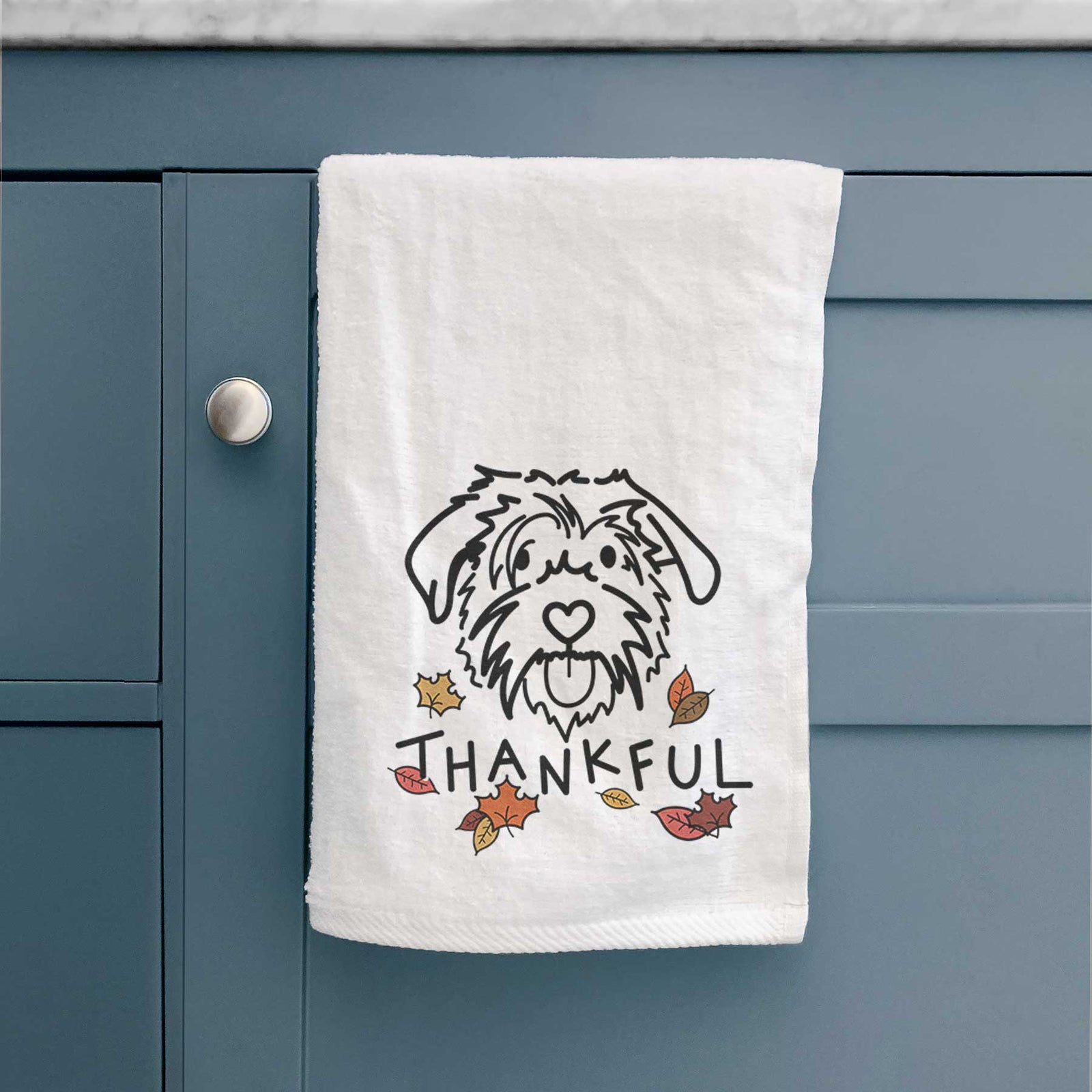 Minimalist line drawing of Amal the Scottish Terrier Border Collie Mix with 'Thankful' lettering on a decorative hand towel