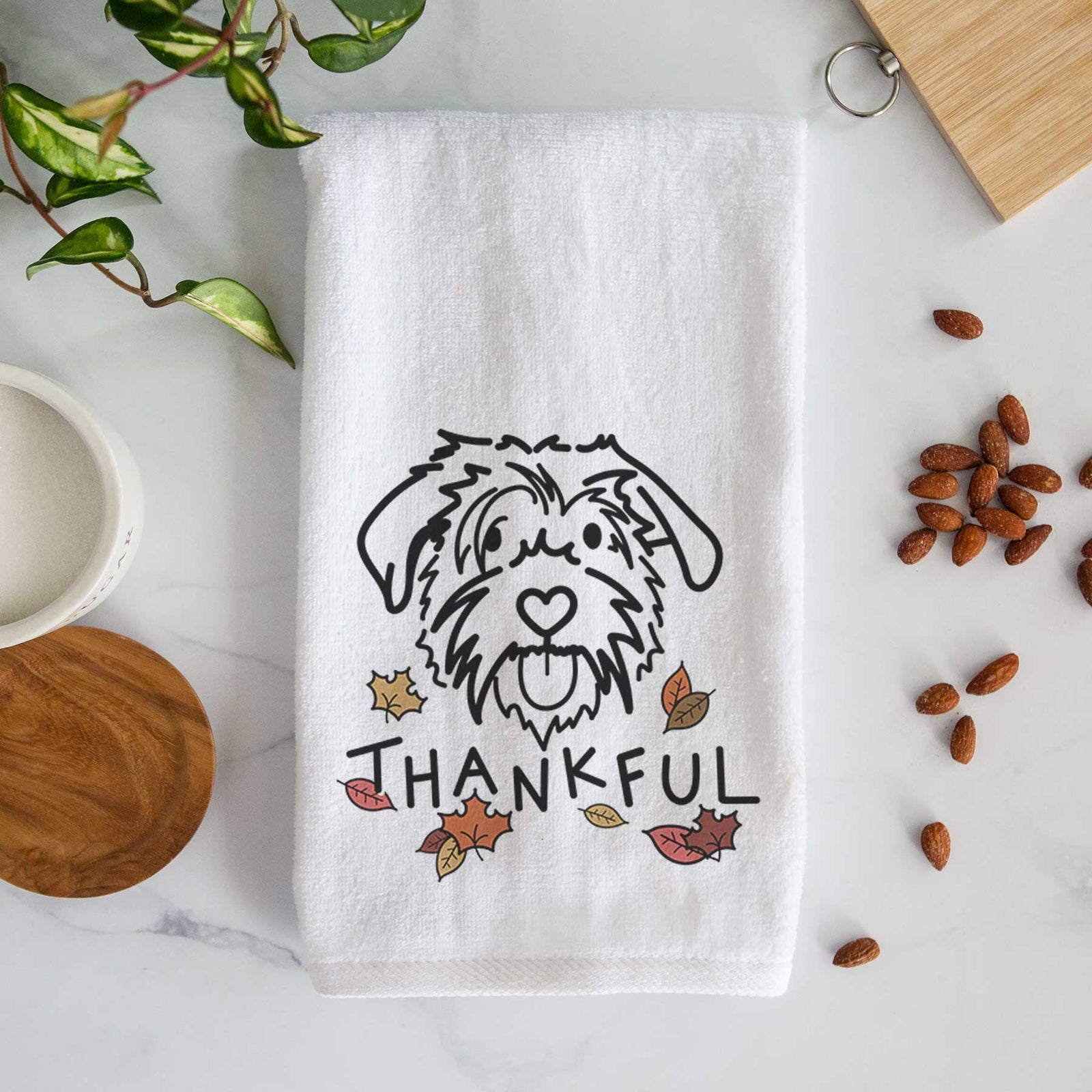 Minimalist line drawing of Amal the Scottish Terrier Border Collie Mix with 'Thankful' lettering on a decorative hand towel