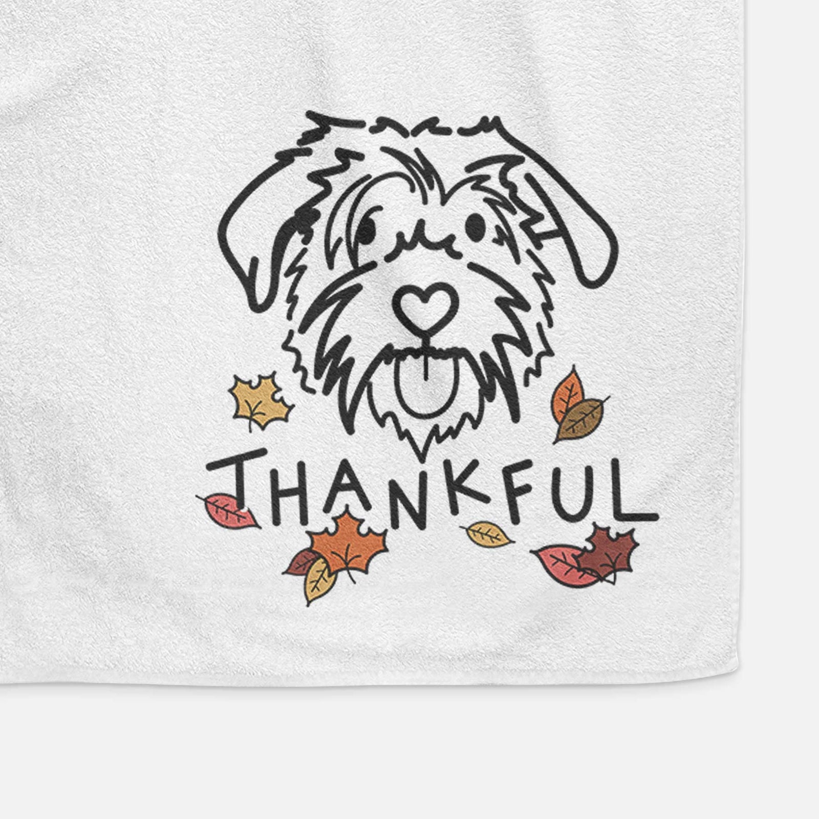 Minimalist line drawing of Amal the Scottish Terrier Border Collie Mix with 'Thankful' lettering on a decorative hand towel
