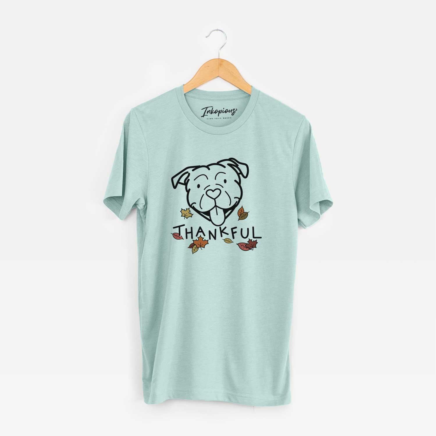 Minimalist line drawing of an American Bulldog with 'Thankful' lettering on a Heather Sage Unisex crewneck