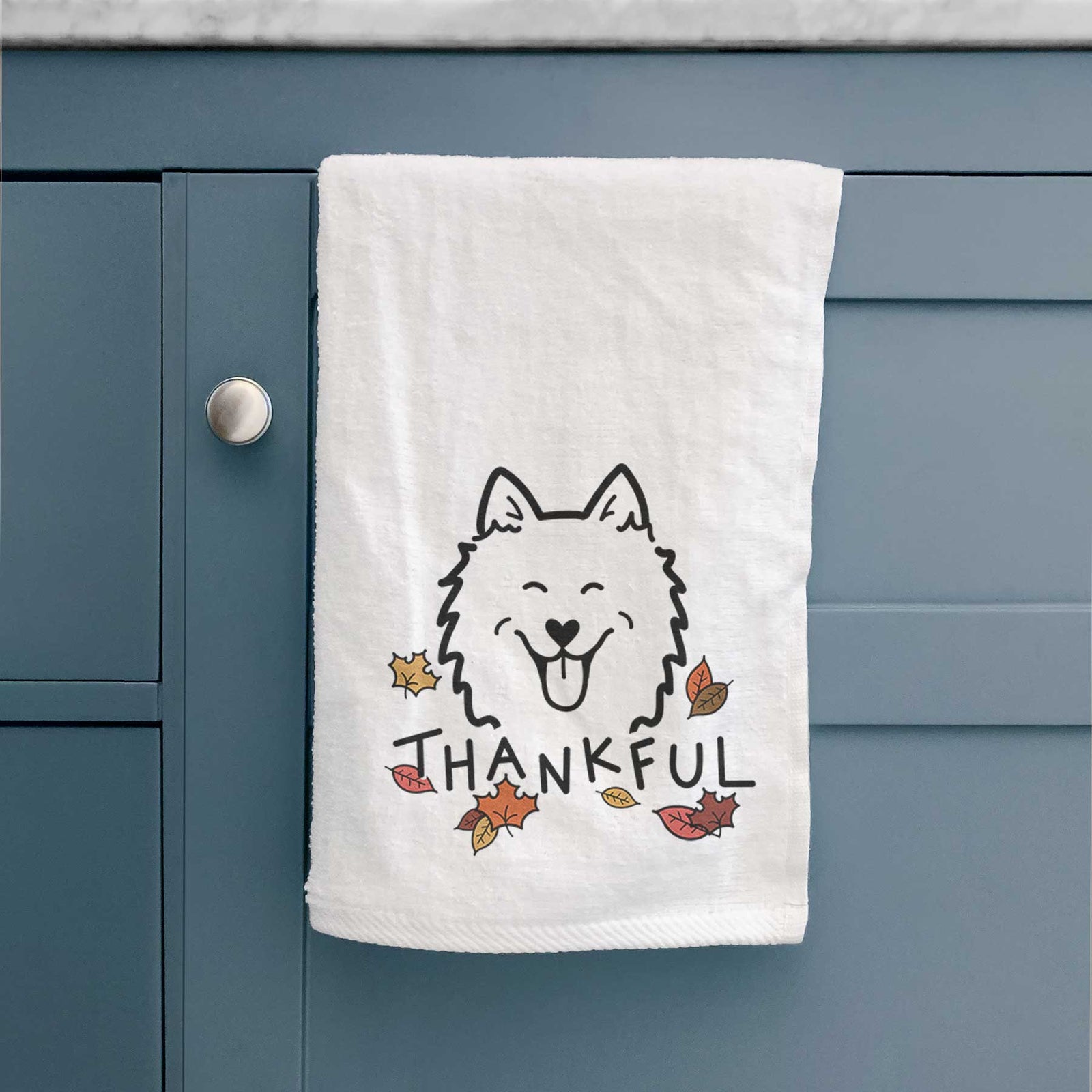 Minimalist line drawing of an American Eskimo with 'Thankful' lettering on a decorative hand towel
