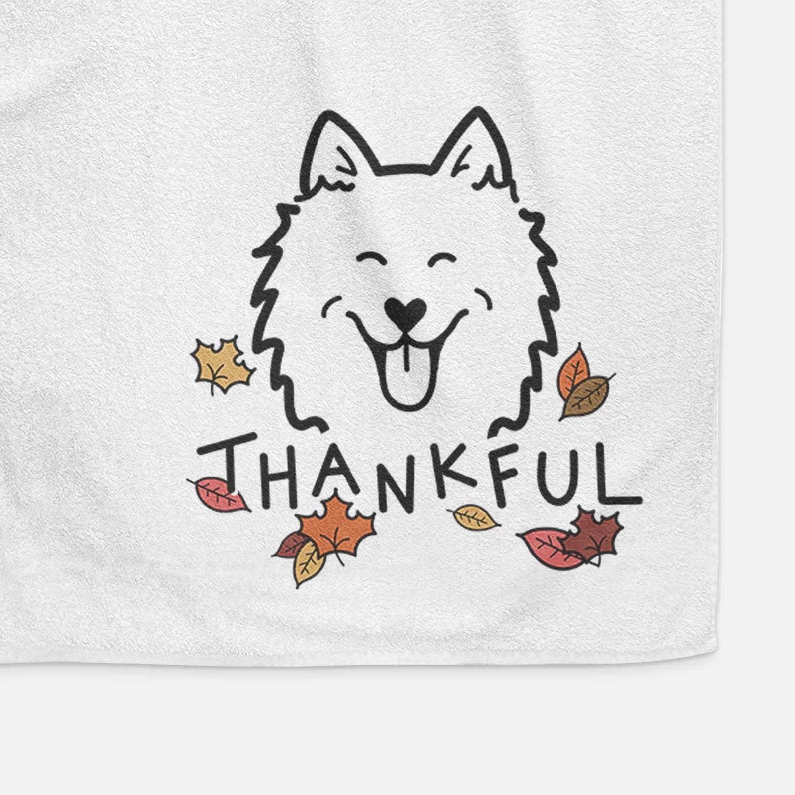 Minimalist line drawing of an American Eskimo with 'Thankful' lettering on a decorative hand towel
