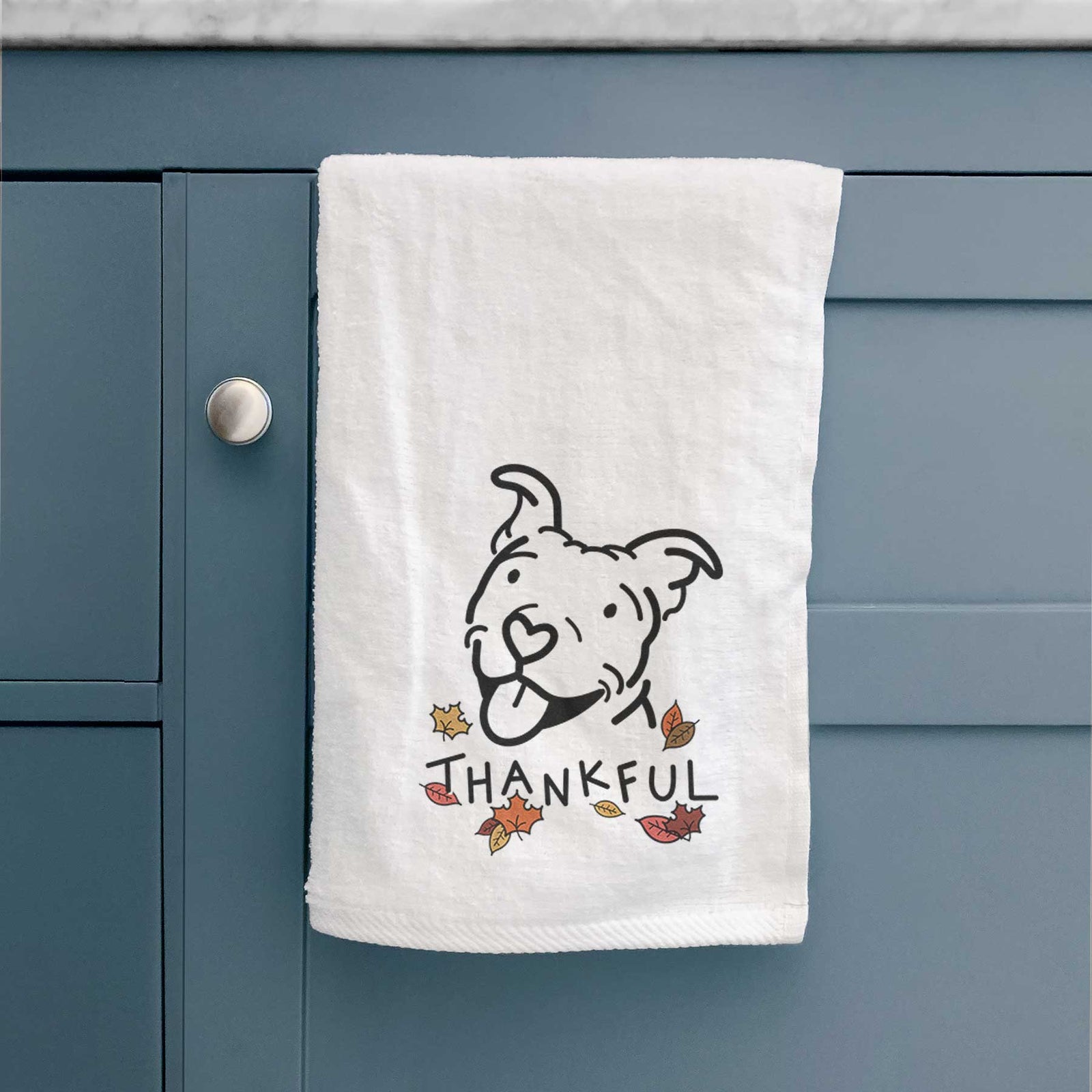 Minimalist line drawing of Arlo the Pitbull with 'Thankful' lettering on a decorative hand towel