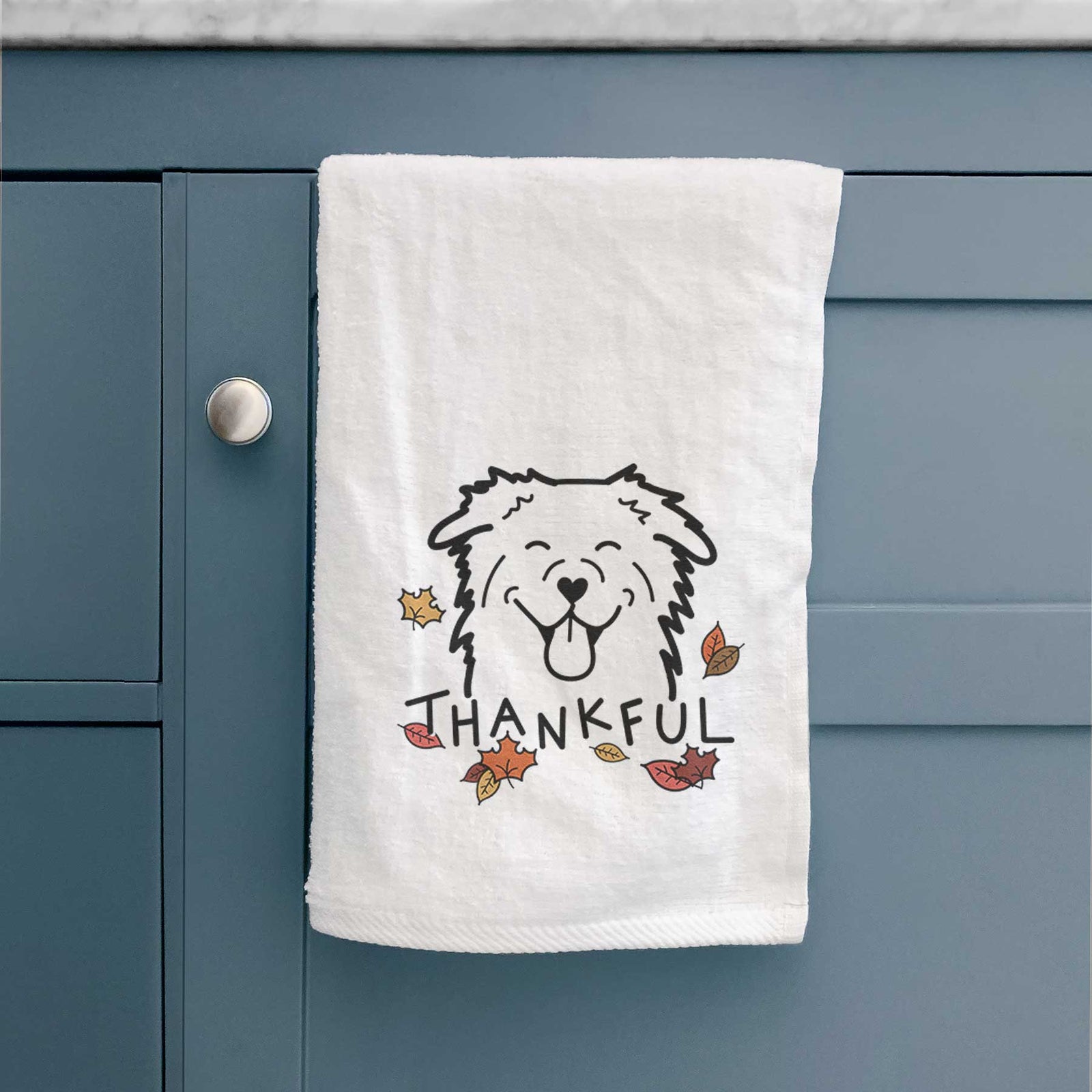 Minimalist line drawing of an Australian Shepherd with 'Thankful' lettering on a decorative hand towel