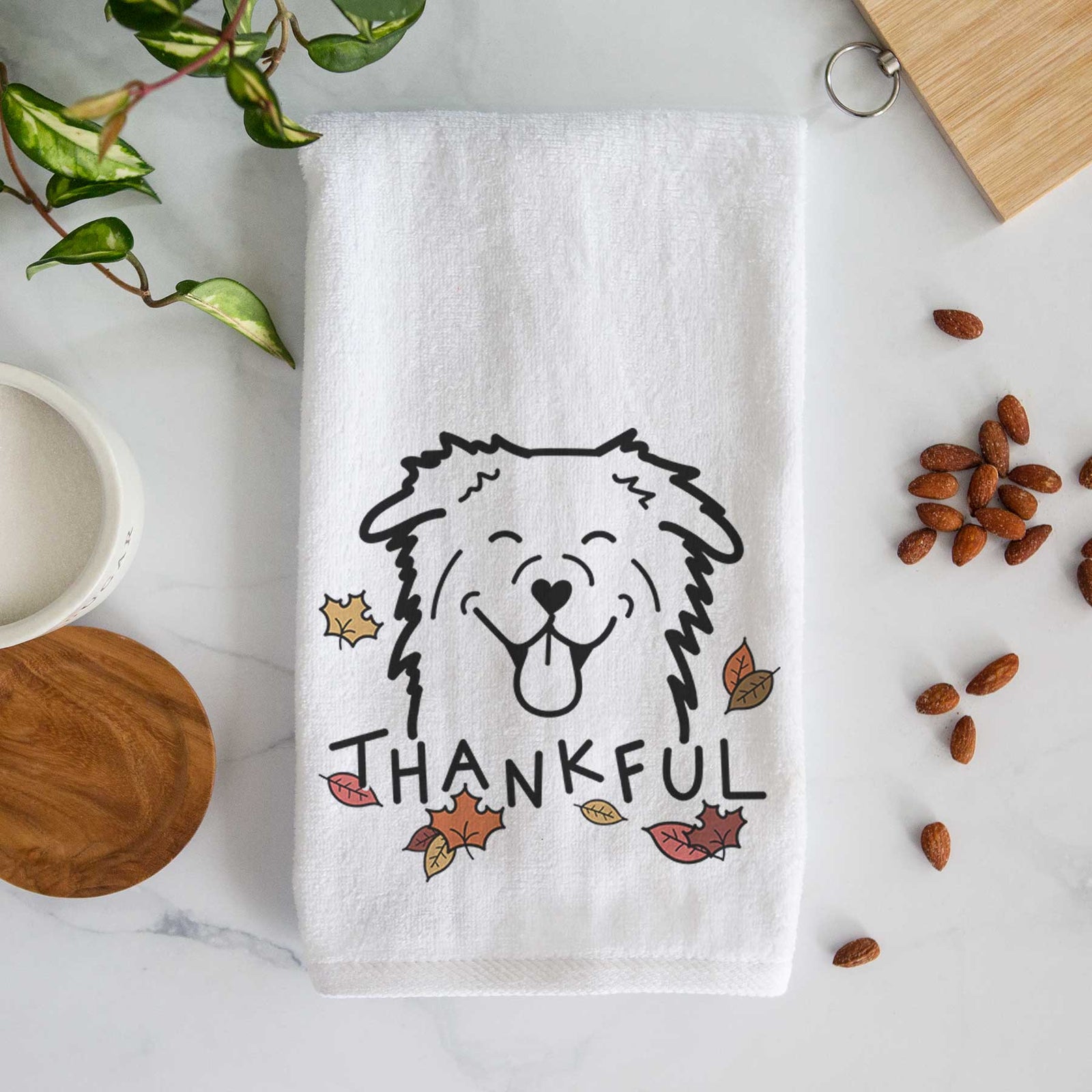 Minimalist line drawing of an Australian Shepherd with 'Thankful' lettering on a decorative hand towel