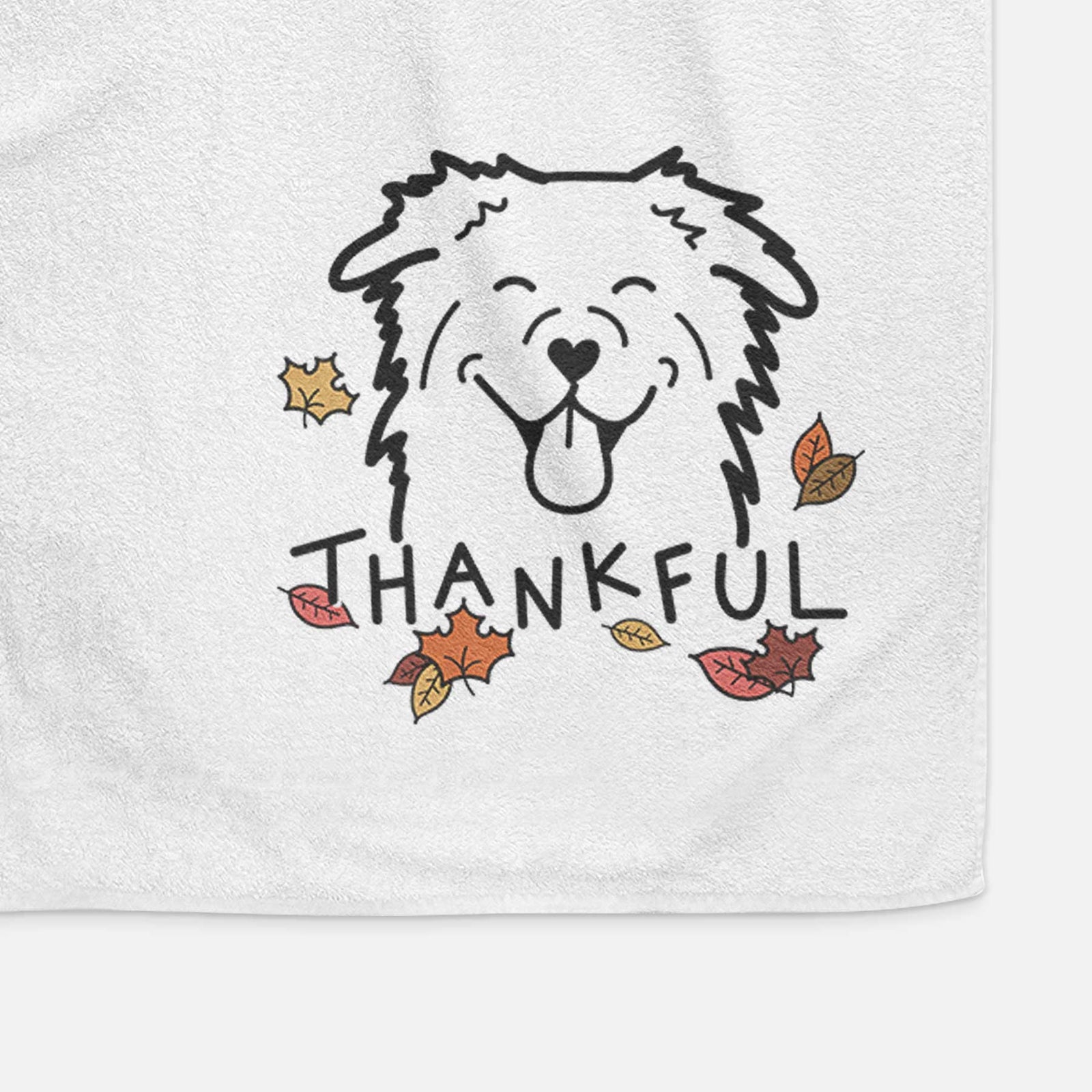 Minimalist line drawing of an Australian Shepherd with 'Thankful' lettering on a decorative hand towel