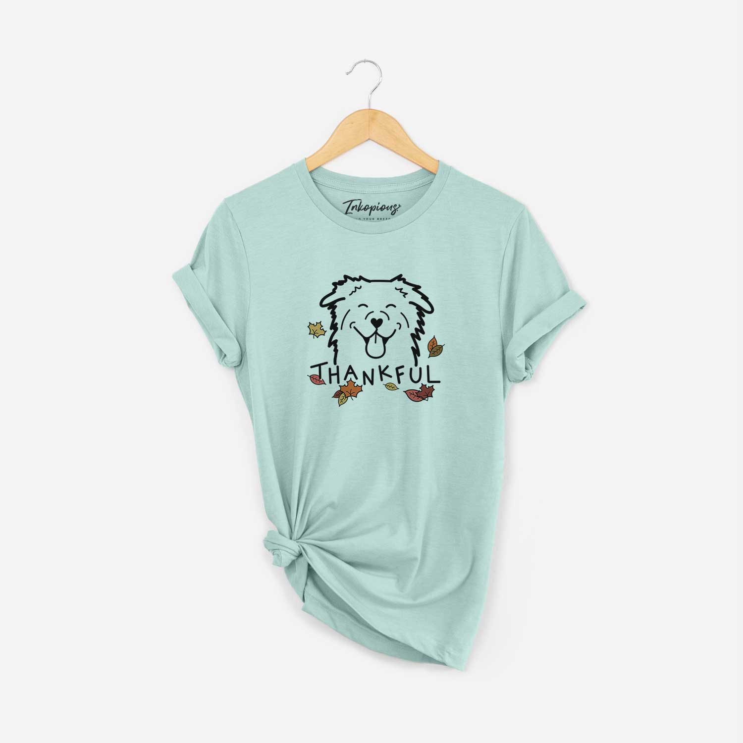 Minimalist line drawing of an Australian Shepherd with 'Thankful' lettering on a Heather Sage Unisex crewneck