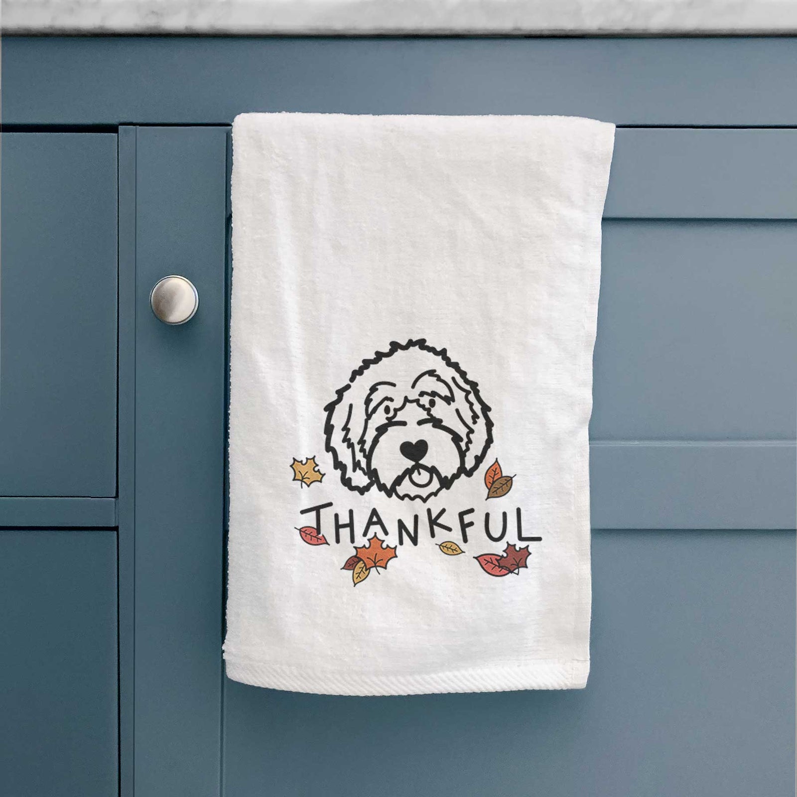 Minimalist line drawing of an Aussiedoodle with 'Thankful' lettering on a decorative hand towel