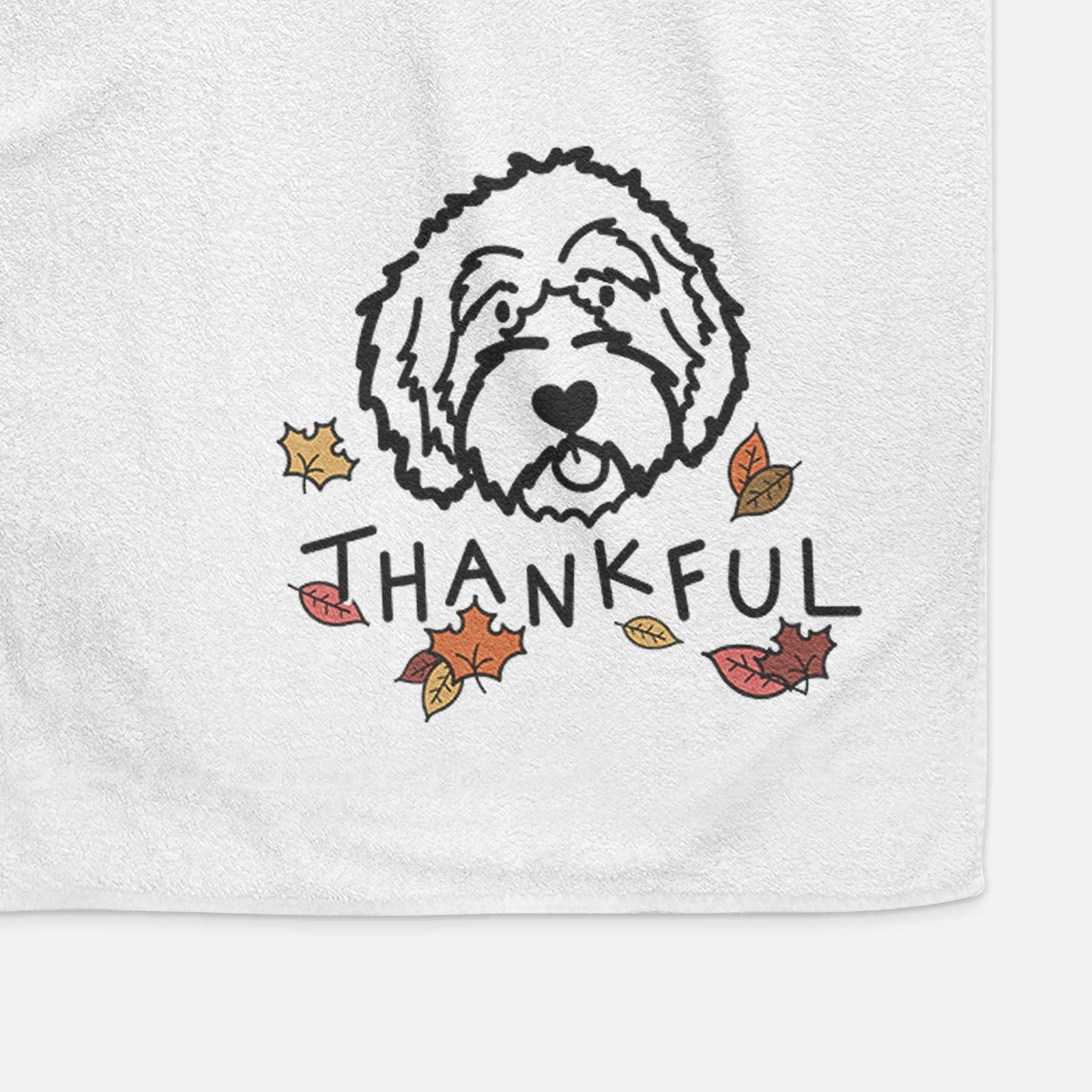 Minimalist line drawing of an Aussiedoodle with 'Thankful' lettering on a decorative hand towel