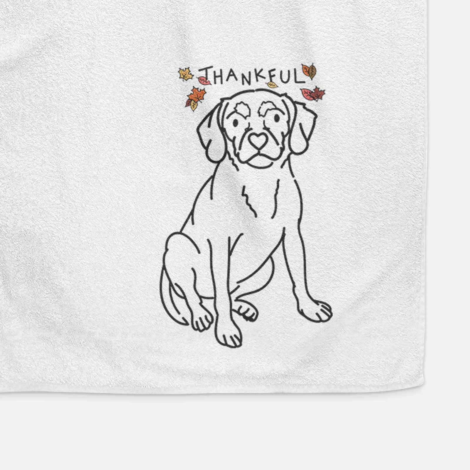 Minimalist line drawing of Babs the Puggle with 'Thankful' lettering on a decorative hand towel