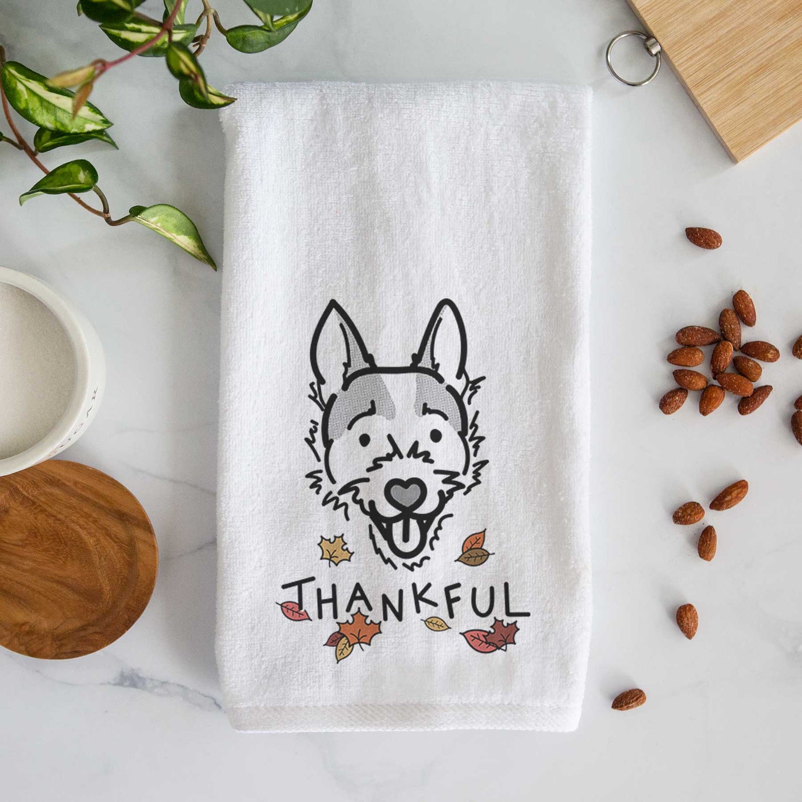Minimalist line drawing of Baxter the Jack Russell Terrier with 'Thankful' lettering on a decorative hand towel