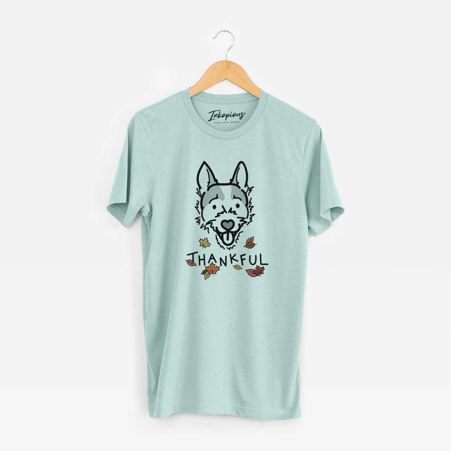 Minimalist line drawing of Baxter the Jack Russell Terrier with 'Thankful' lettering on a Heather Sage Unisex crewneck