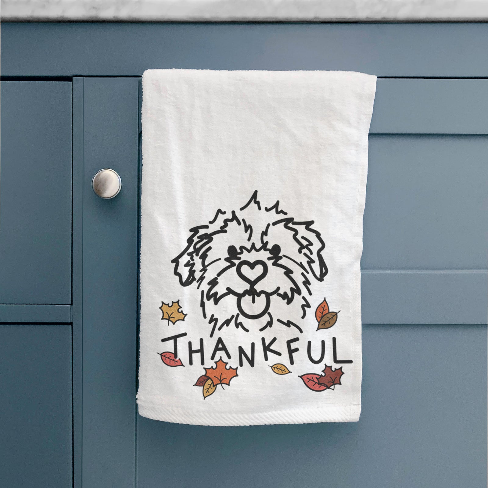 Minimalist line drawing of Bea the Mixed Breed with 'Thankful' lettering on a decorative hand towel