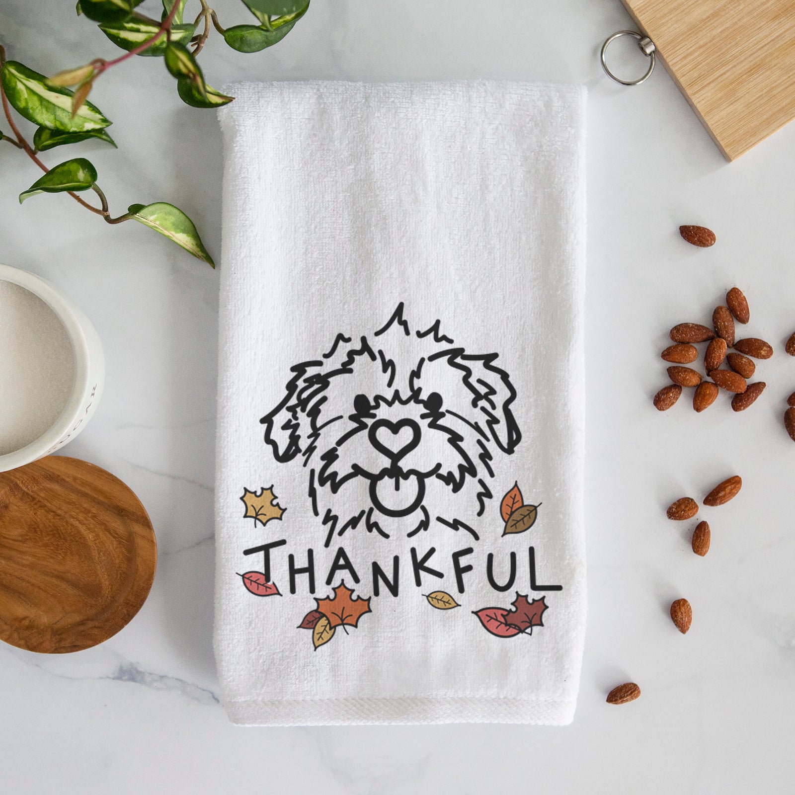 Minimalist line drawing of Bea the Mixed Breed with 'Thankful' lettering on a decorative hand towel