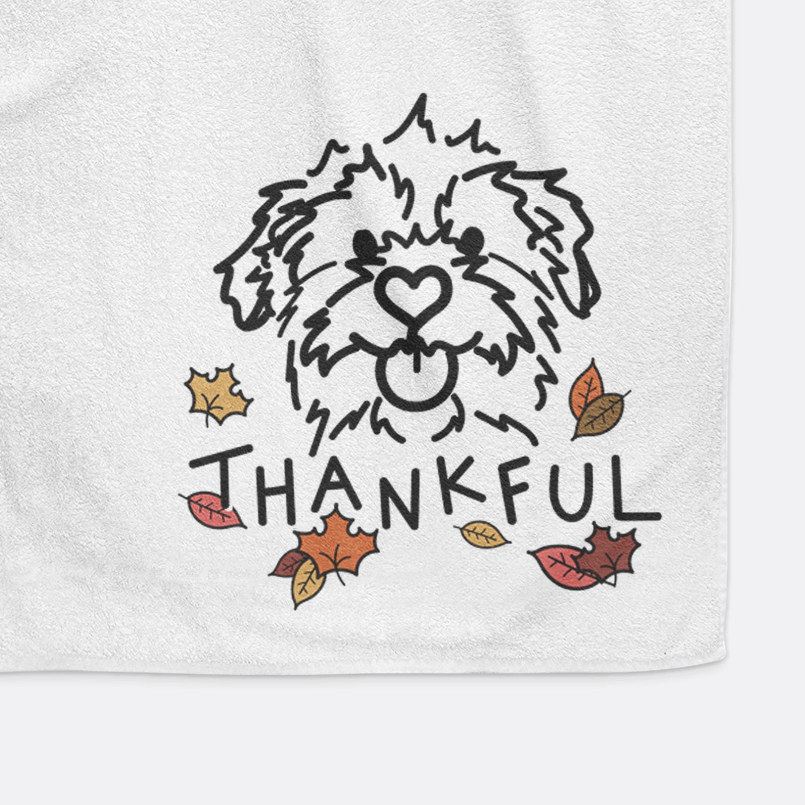 Minimalist line drawing of Bea the Mixed Breed with 'Thankful' lettering on a decorative hand towel