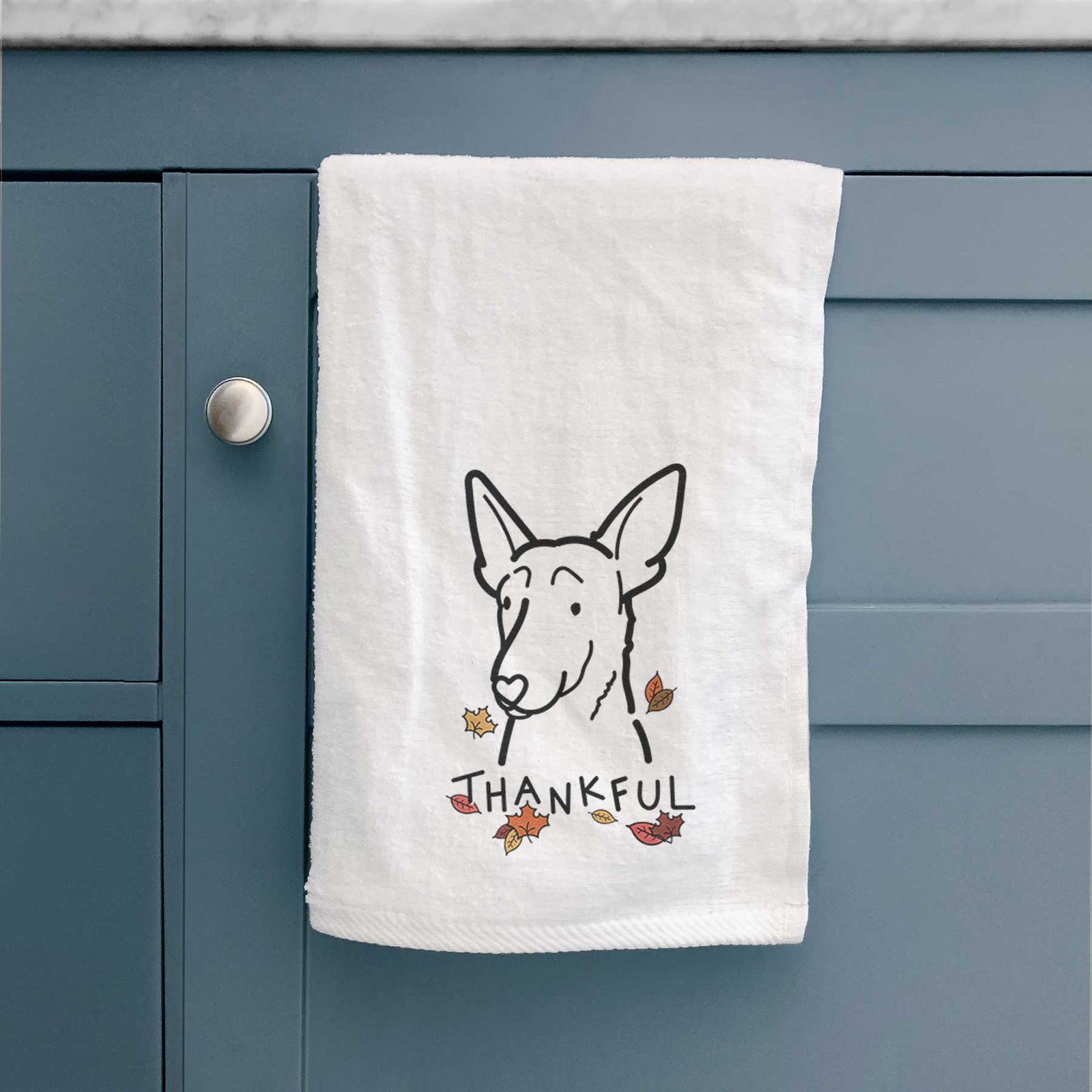 Minimalist line drawing of a Belgian Malinois with 'Thankful' lettering on a decorative hand towel