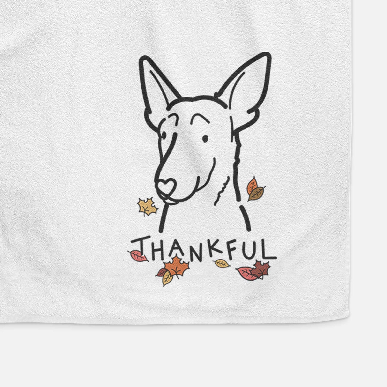 Minimalist line drawing of a Belgian Malinois with 'Thankful' lettering on a decorative hand towel