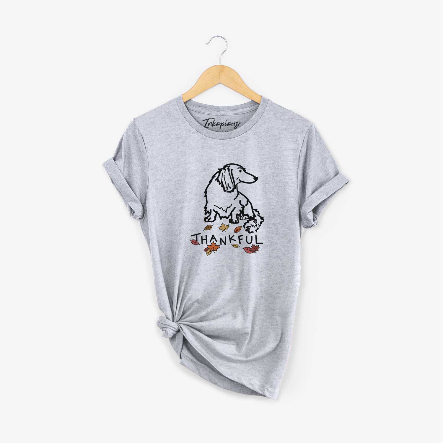 Minimalist line drawing of Bella the Dachshund with 'Thankful' lettering on a Grey Unisex crewneck