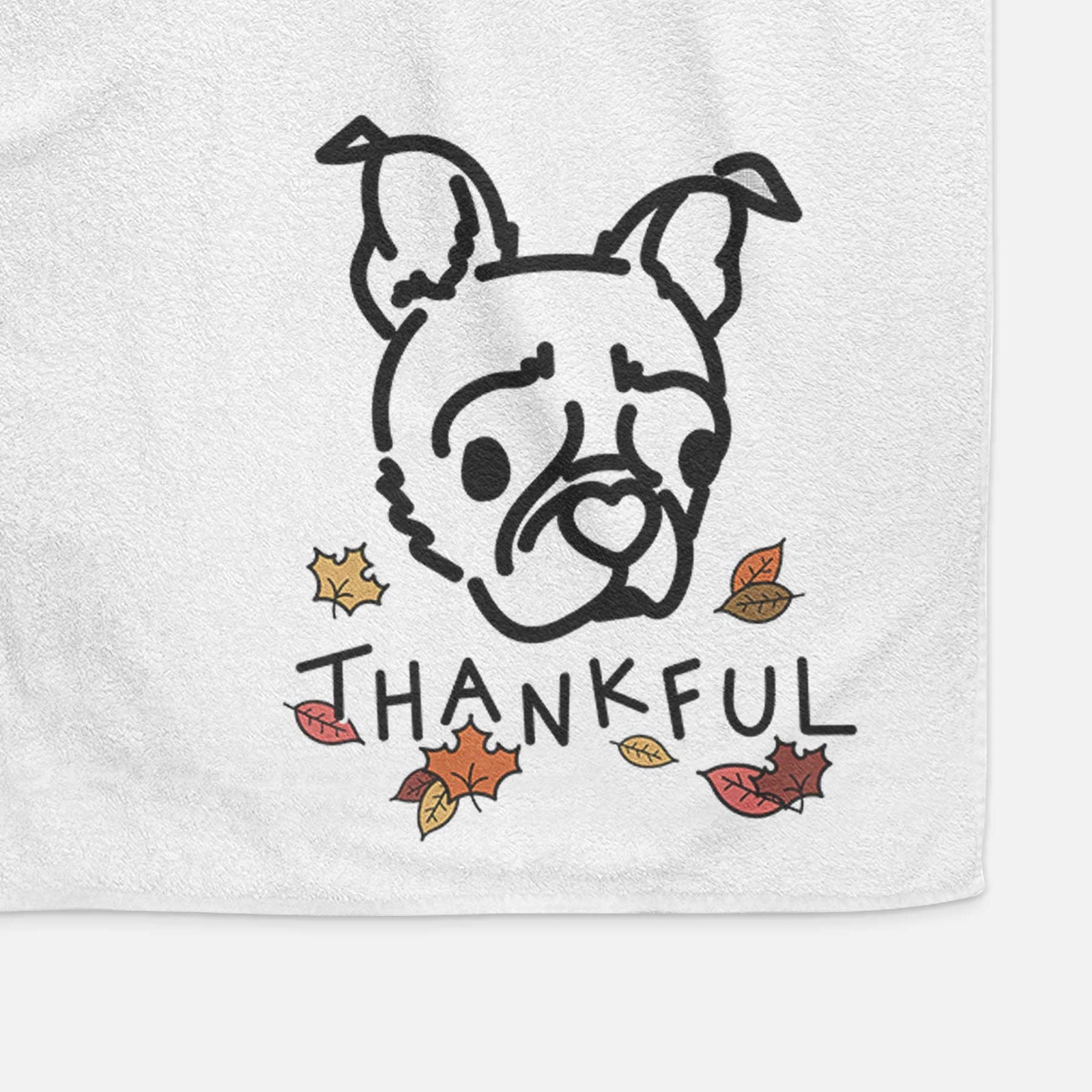 Minimalist line drawing of Bella the Pug Boston Terrier Mix with 'Thankful' lettering on a decorative hand towel