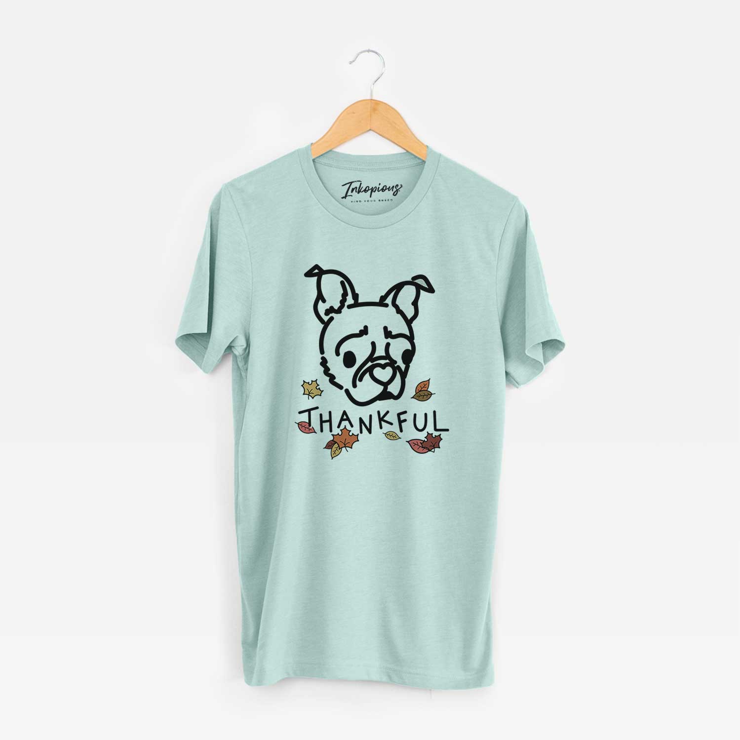 Minimalist line drawing of Bella the Pug Boston Terrier Mix with 'Thankful' lettering on a Heather Sage Unisex crewneck