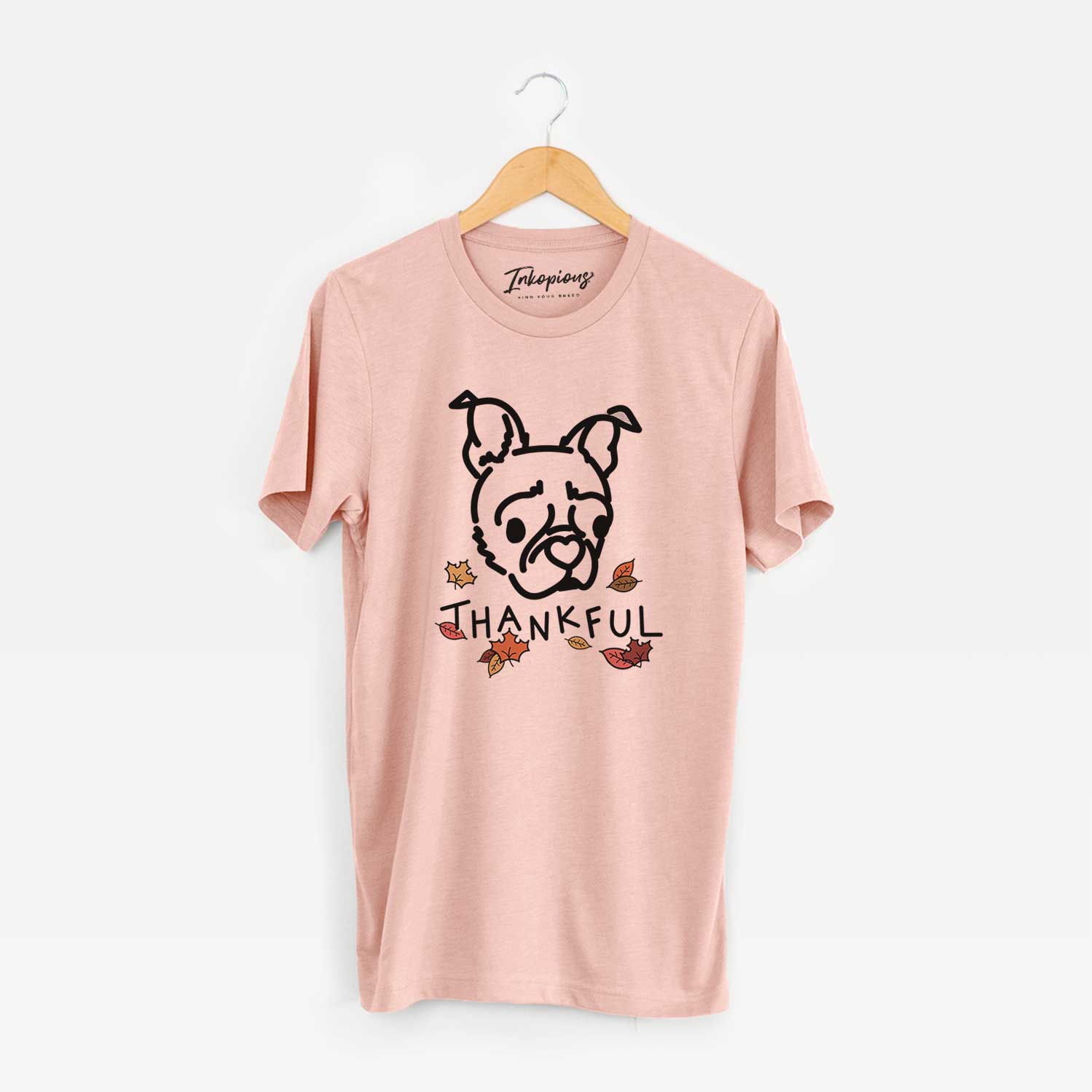 Minimalist line drawing of Bella the Pug Boston Terrier Mix with 'Thankful' lettering on a Peach Unisex crewneck